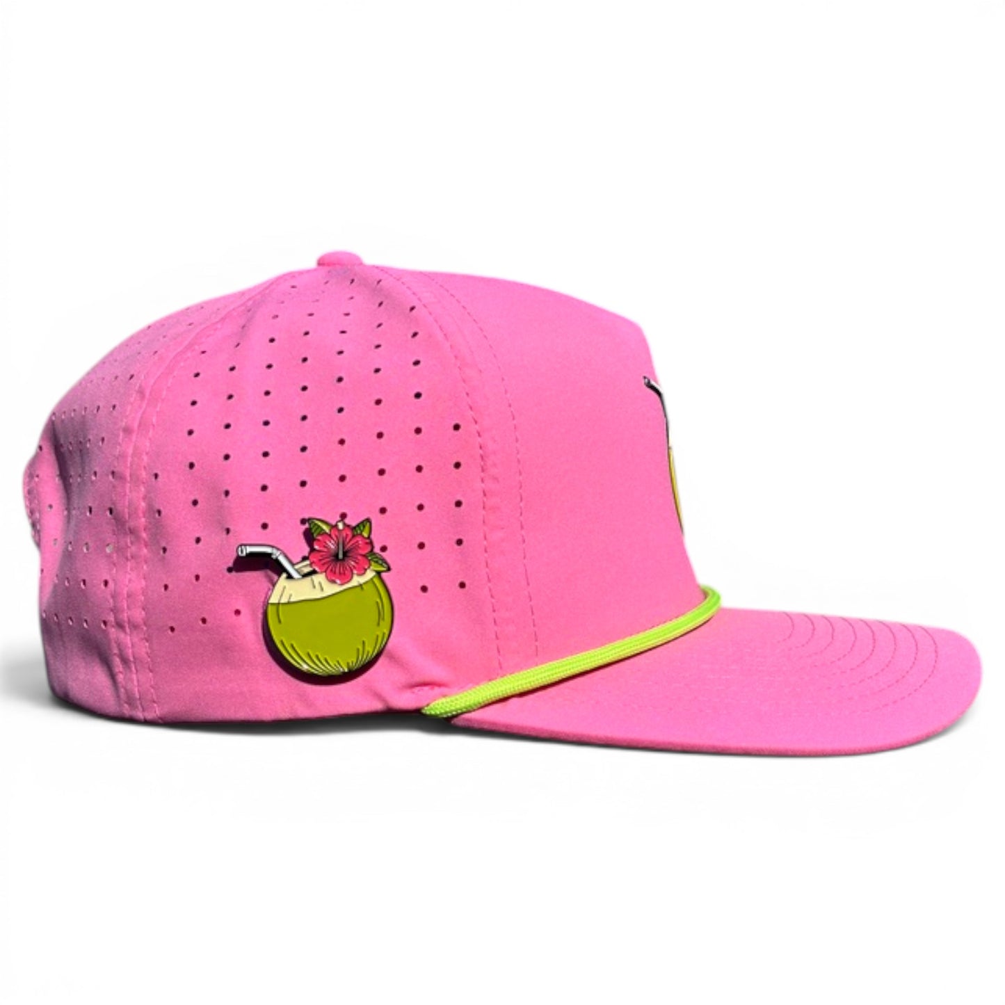 The Coconut Cocktail Golf Hat is a bright pink snapback cap with small ventilation holes, cartoon coconut drink detail, neon yellow trim, adjustable fit, and a built-in magnetic ball marker holder with marker included—perfect for golf enthusiasts.