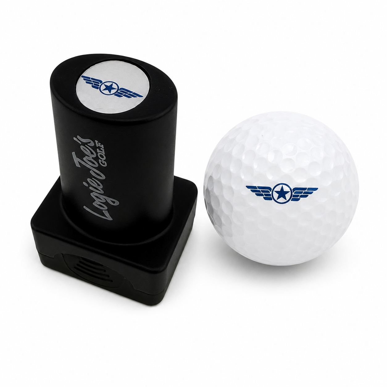 A Wings Stamp with quick-dry ink lies beside a white golf ball featuring a blue star and wings logo, both on a white background—ideal for fans wanting easy ball identification or a fun golf gift.