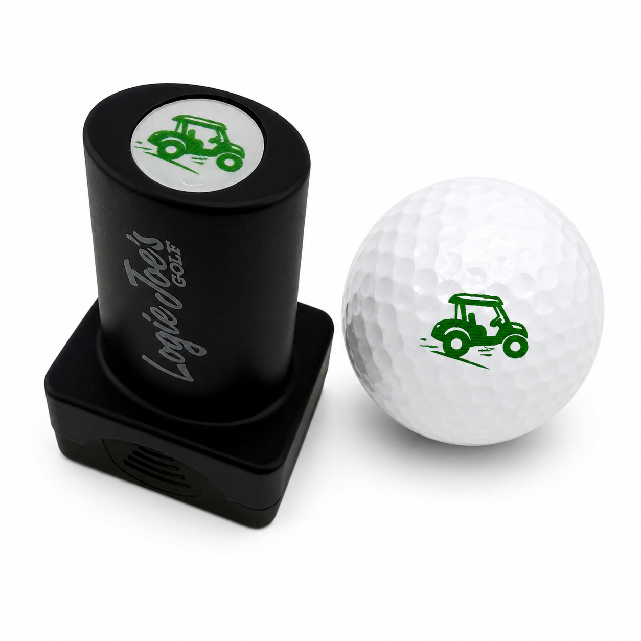 A black Golf Cart Golf Ball Stamp with quick-dry ink and a green golf cart design sits beside a white ball stamped with the same image, making ball identification easy—an ideal fun gift for fans of personalized golf gear.