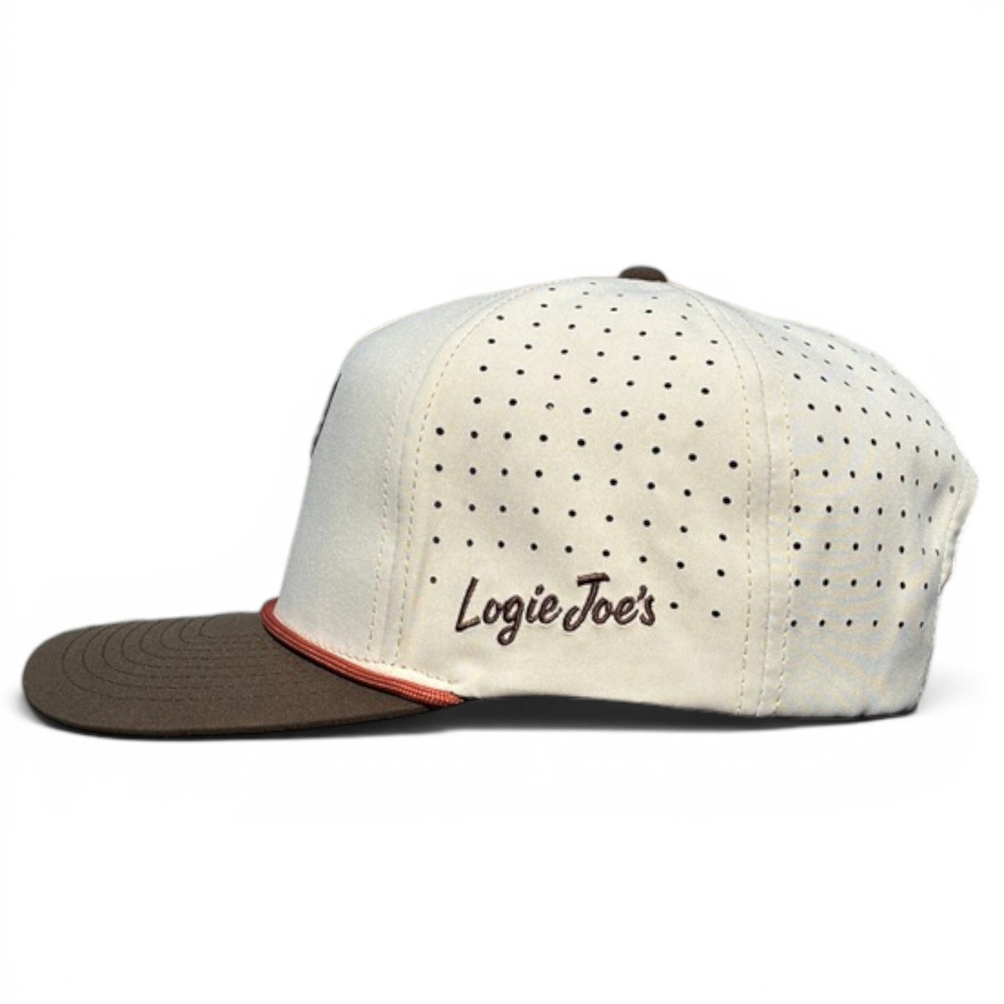 A cream-colored Longhorn Golf Hat snapback with brown visor, side vents, "Logie Joes" embroidery, magnetic ball marker holder (marker included), and an adjustable tan bull skull—perfect for on or off the course.