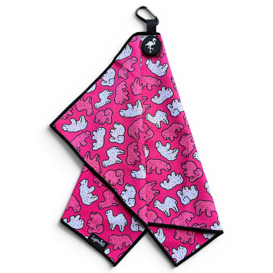 The Frosted Animal Cookie Golf Towel is a 24” x 16” pink microfiber towel with blue and pink cartoon bears, black trim, a logo button, magnetic clip, and carabiner—perfect as a premium golf accessory.