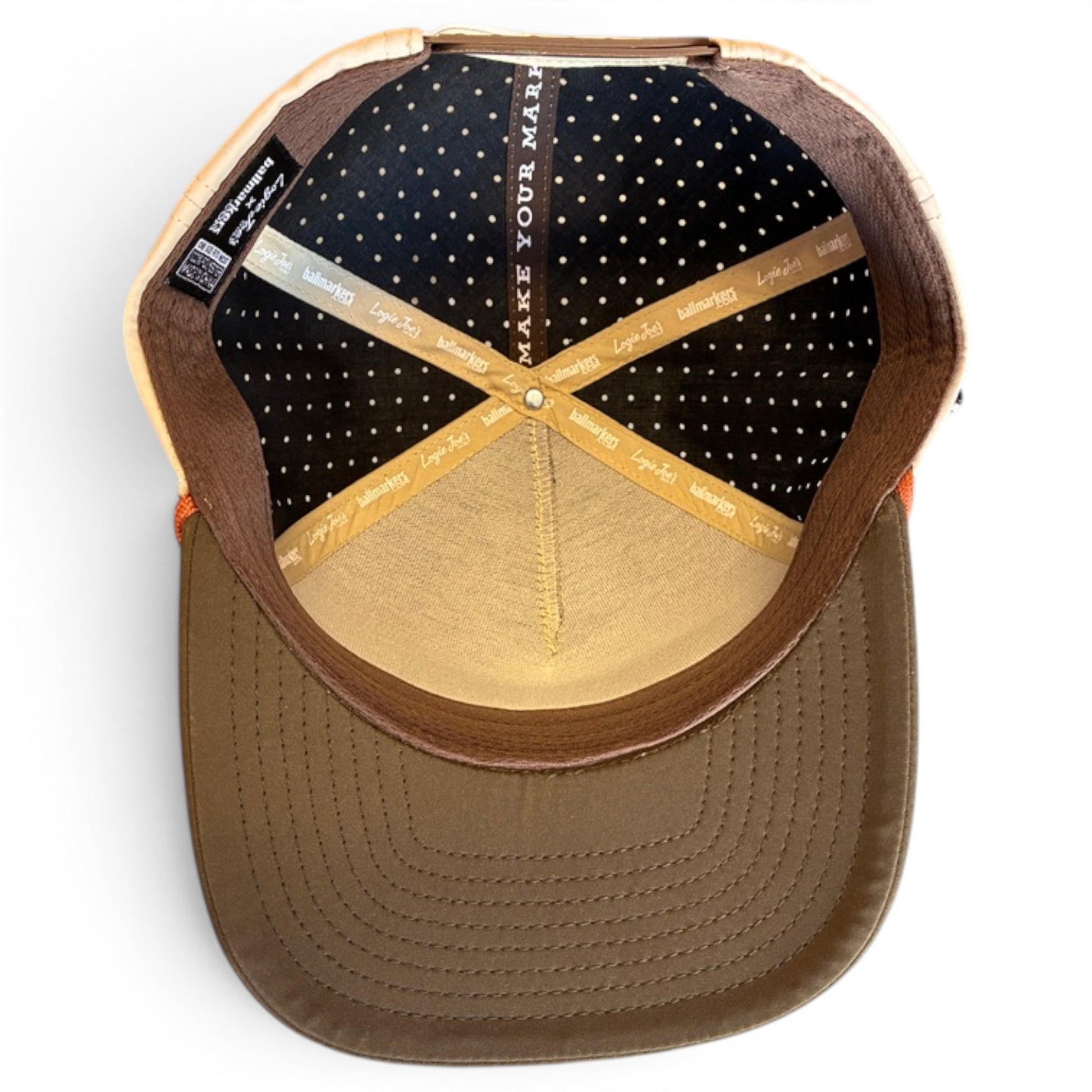 The Longhorn Golf Hat | Snapback Cap features brown and tan colors, a dotted black inside lining, tan seams labeled Legacy 92, "MAKE YOUR MARK" at the top, plus an adjustable fit and a built-in magnetic ball marker holder with marker included.