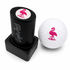 A perfect golf gift: the Flamingo Golf Ball Stamp with quick-dry ink for easy ball identification and a fun pink flamingo design, plus a white ball. The stamp stands upright with its black holder, also serving as a unique ball marker.