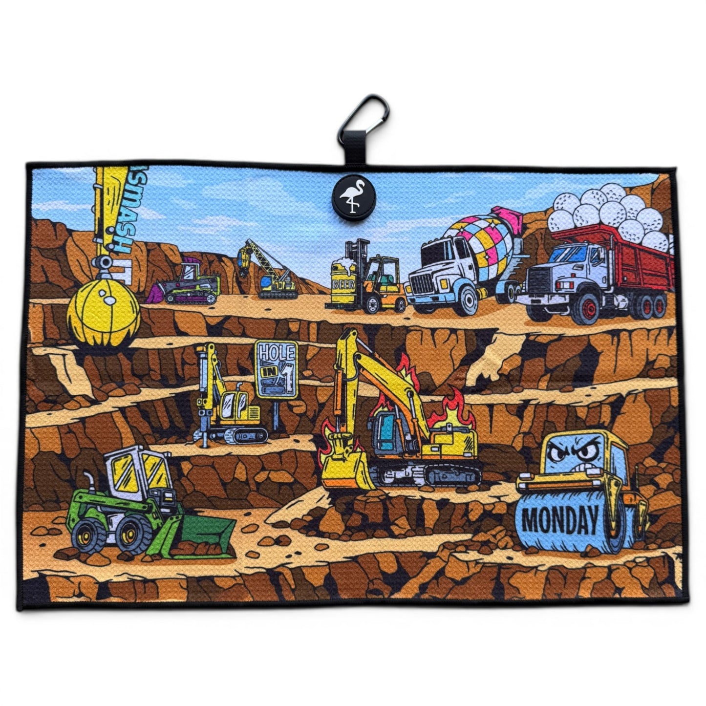 The Wrecking Crew Golf Towel is a 24” x 16” illustrated microfiber towel with cartoon vehicles like excavators, bulldozers, a cement mixer, and a MONDAY-labeled dump truck working in a layered pit. Includes magnetic clip & carabiner.