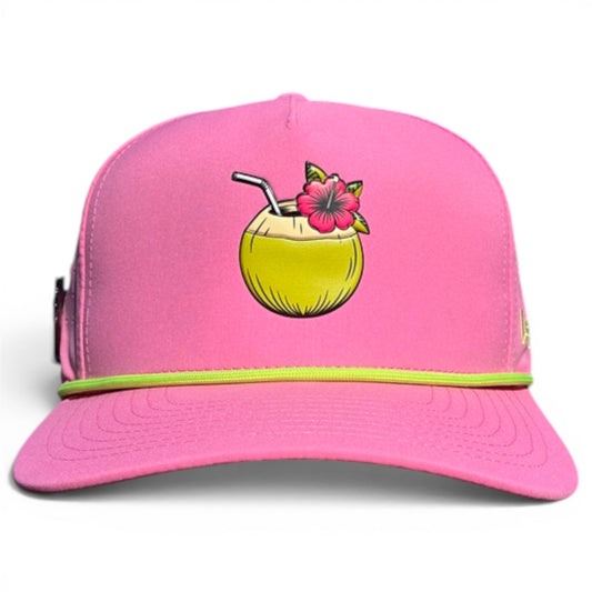 A bright pink Coconut Cocktail Golf Hat snapback with a yellow coconut drink graphic, straw, and red flower on the front. Features green trim, adjustable fit, and built-in magnetic ball marker holder with marker included.