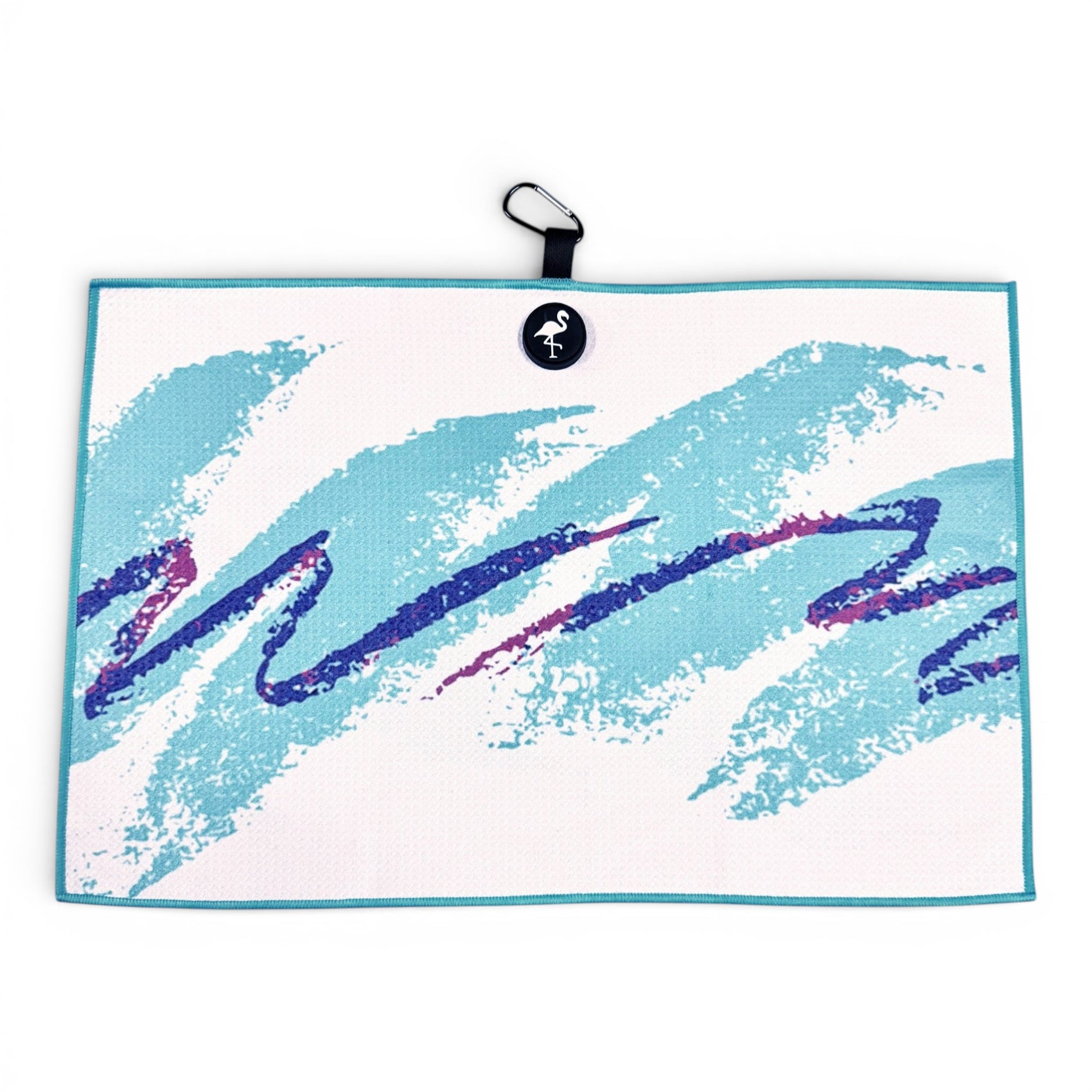 The 90s Party Cup Golf Towel is a white, rectangular 24x16" microfiber towel featuring teal and purple retro brushstroke patterns, a black hanging loop with flamingo logo, sturdy magnetic backing, and carabiner clip.
