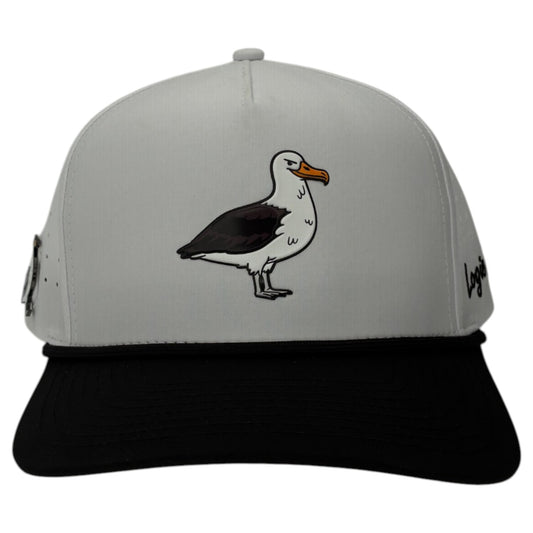 The Albatross Golf Hat is a white and black adjustable snapback cap with a cartoon bird on the front, side and brim logos, plus a built-in magnetic ball marker holder with marker included for easy use on the course.