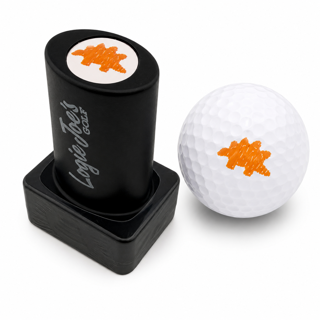 A Dino Chicken Nugget Golf Ball Stamp sits next to a white golf ball, both marked with a fun dino nugget design—making for easy ball identification and a unique golf gift.