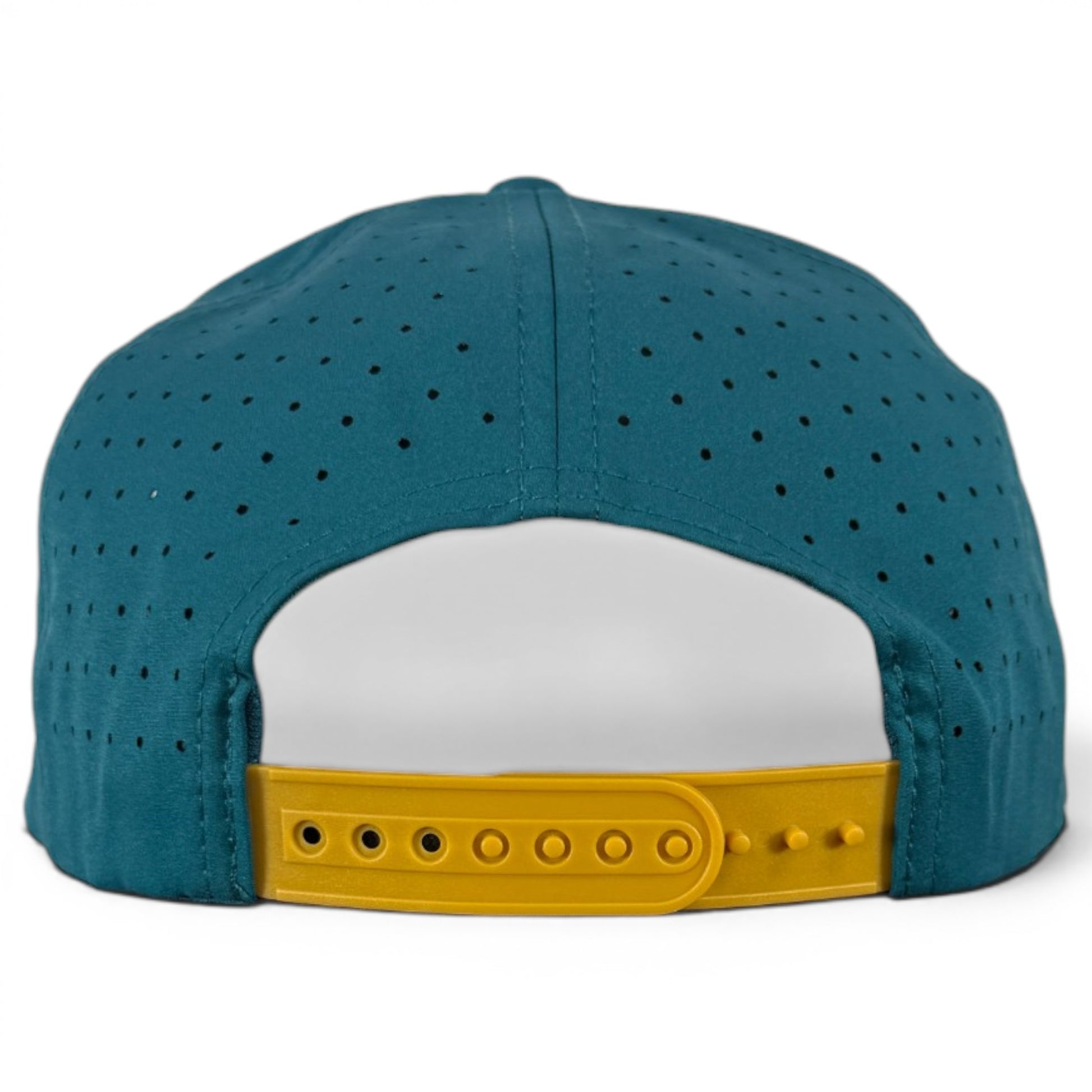 The image shows the Driftwood Golf Hat in Wood Boat Teal, an adjustable snapback cap with small ventilation holes and a built-in magnetic ball marker holder plus marker for convenience on the course.