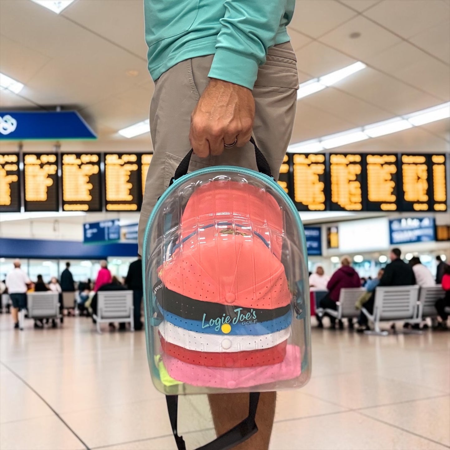 Hat Caddy with clear bag holding colorful hats, featuring text on benefits and uses. travel, hat case, hat caddy, travel gear, hat storage, hat organizer, airport, golf, golf accessories, baseball caps, snapback, trucker hats, gift