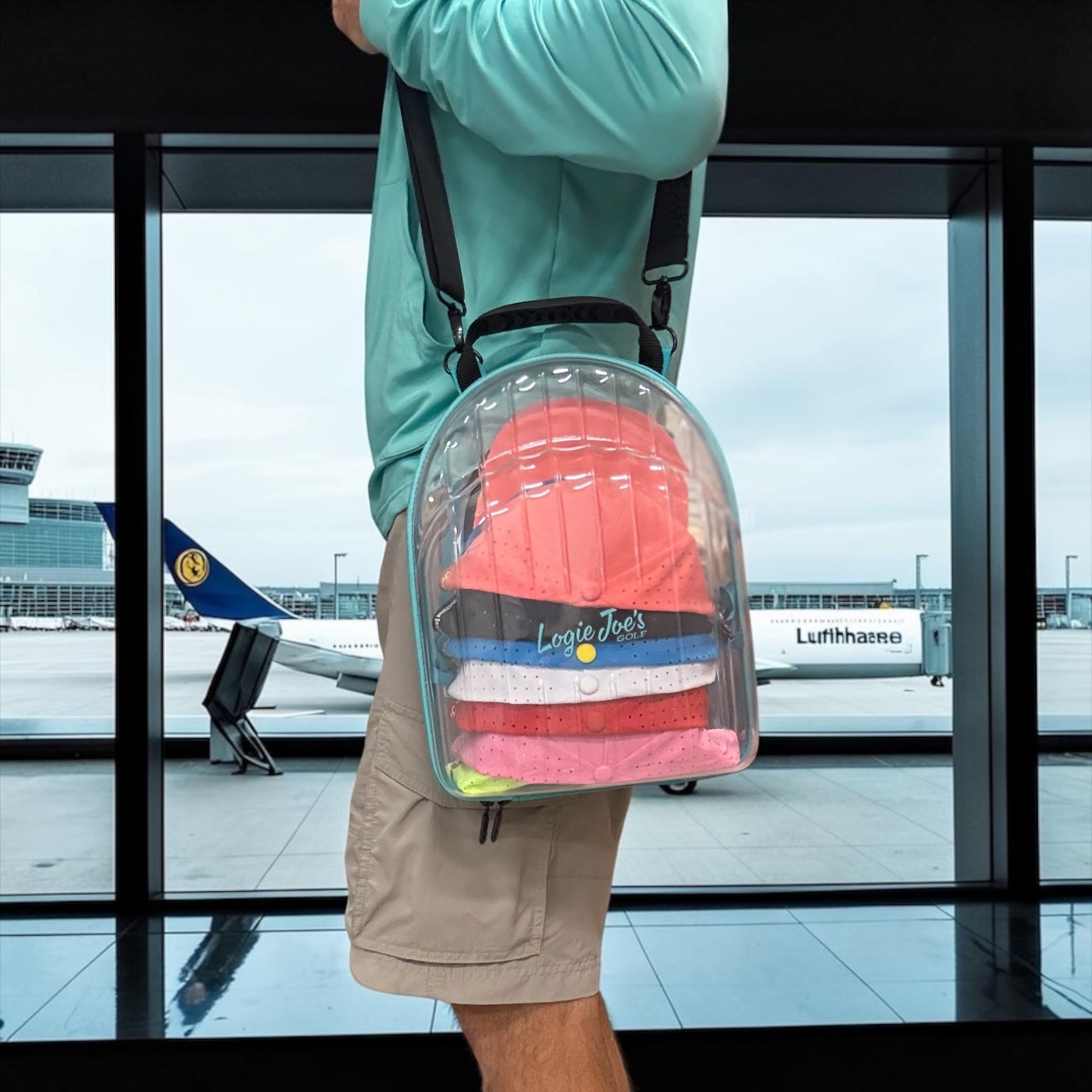 Hat Caddy with clear bag holding colorful hats, featuring text on benefits and uses. travel, hat case, hat caddy, travel gear, hat storage, hat organizer, airport, golf, golf accessories, baseball caps, snapback, trucker hats, gift