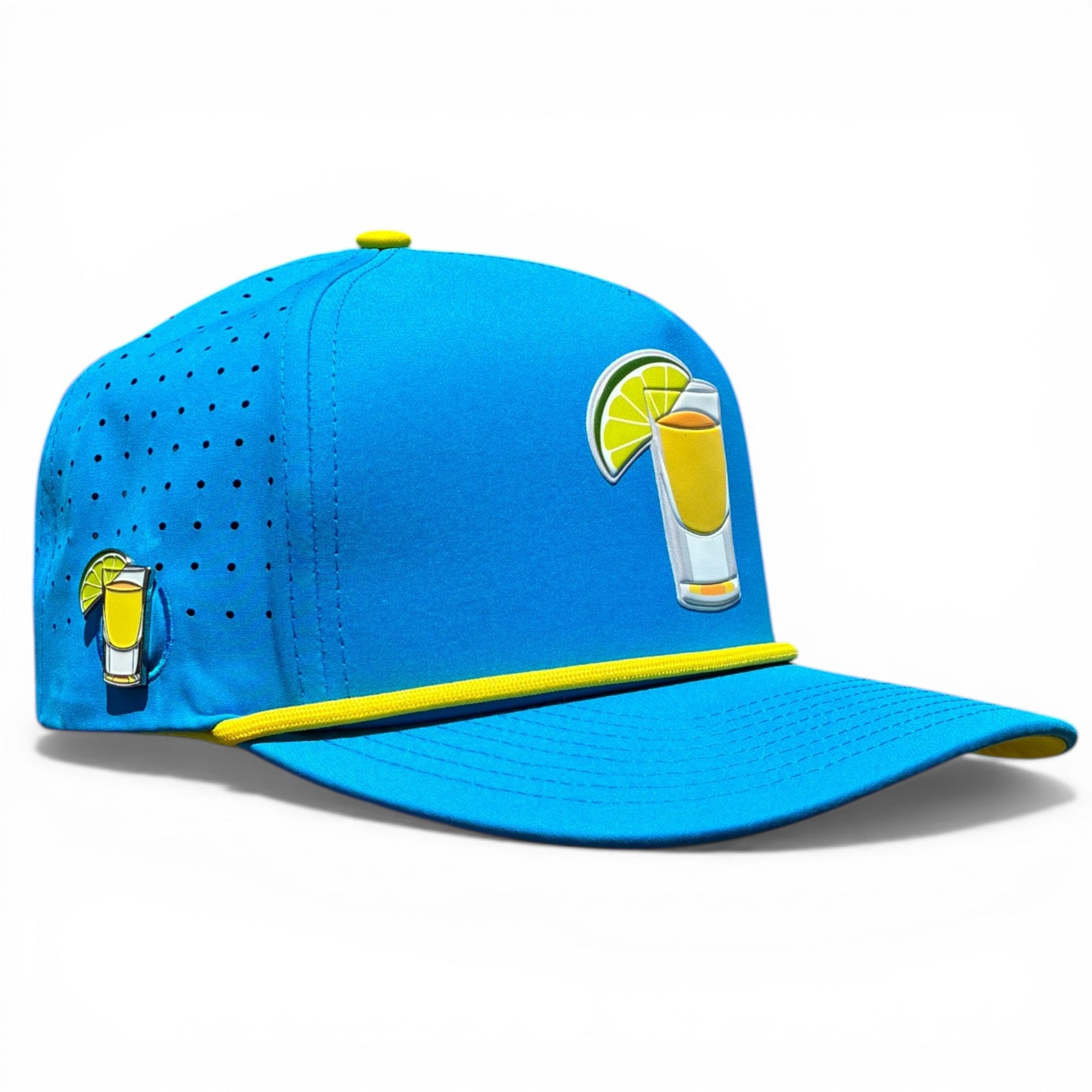 The Tequila and Lime Golf Hat is a bright blue snapback cap with yellow trim, featuring shot glass embroidery, an adjustable fit, and a built-in magnetic ball marker holder with marker included. Premium golf headwear.