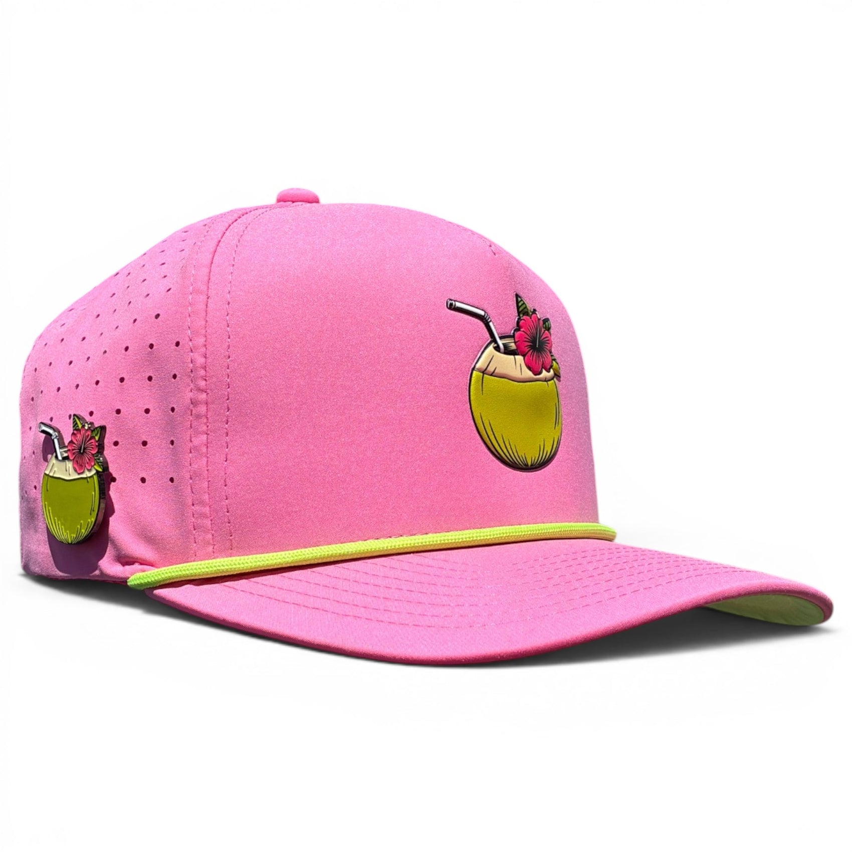 The Coconut Cocktail Golf Hat is a bright pink snapback cap featuring a yellow coconut drink graphic, neon yellow trim, ventilation holes, an adjustable fit, and includes a built-in magnetic ball marker holder with marker. Perfect for golf lovers!.