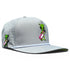 The Alien Caddy Golf Hat is a light gray snapback cap featuring a cartoon green alien with a pink and white golf bag, ventilation holes, curved brim, adjustable fit, and a built-in magnetic ball marker holder with marker included.