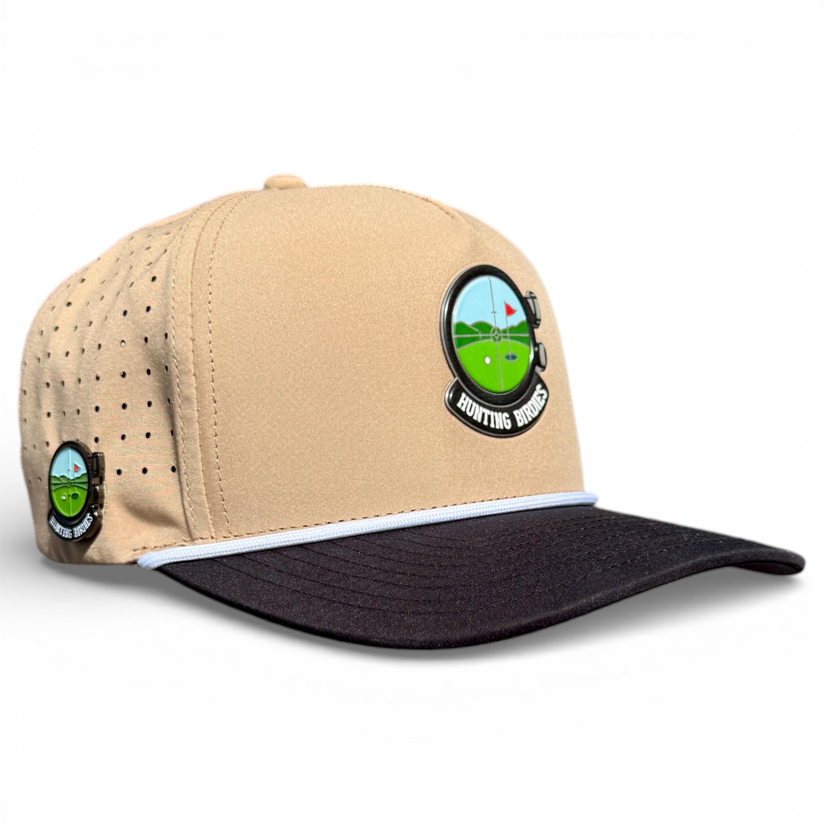 The Hunting Birdies Golf Hat is an adjustable tan and black snapback cap with a golf patch, perforated for ventilation, and includes a built-in magnetic ball marker holder plus marker.