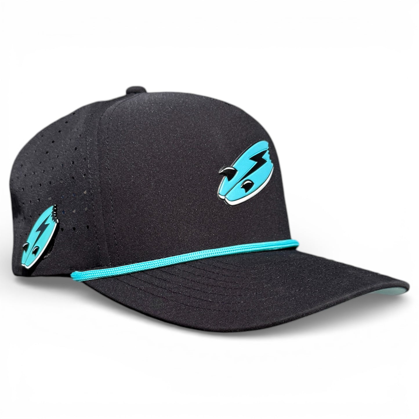 The Shark Bite Golf Hat is a black adjustable snapback cap with a turquoise lightning bolt logo, turquoise brim trim, ventilation holes, and a built-in magnetic ball marker holder plus marker included. One size fits most.