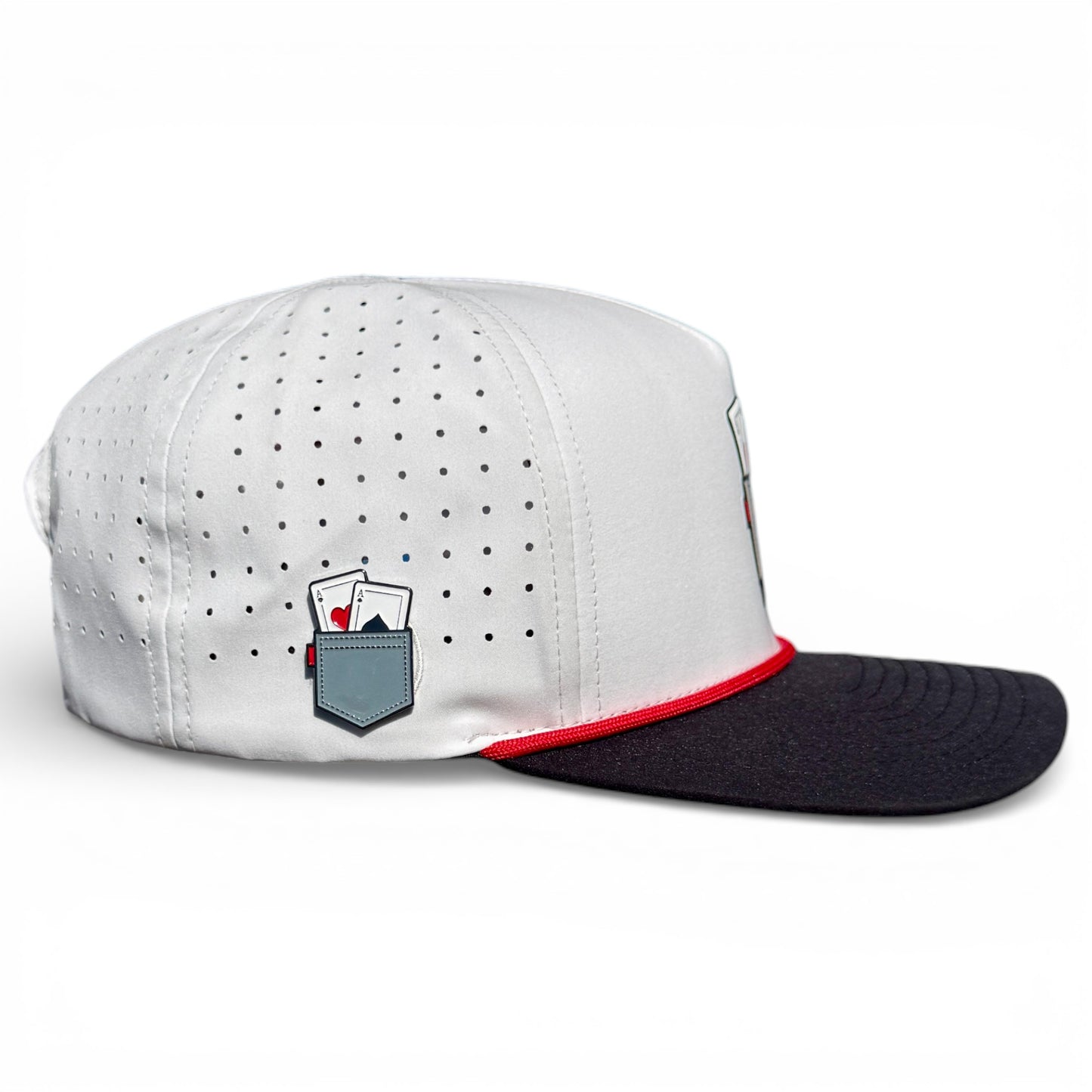 The Pocket Aces Golf Hat is an adjustable gray and black snapback with a built-in magnetic ball marker holder, included marker, and an embroidered pocket with two playing cards on the side.
