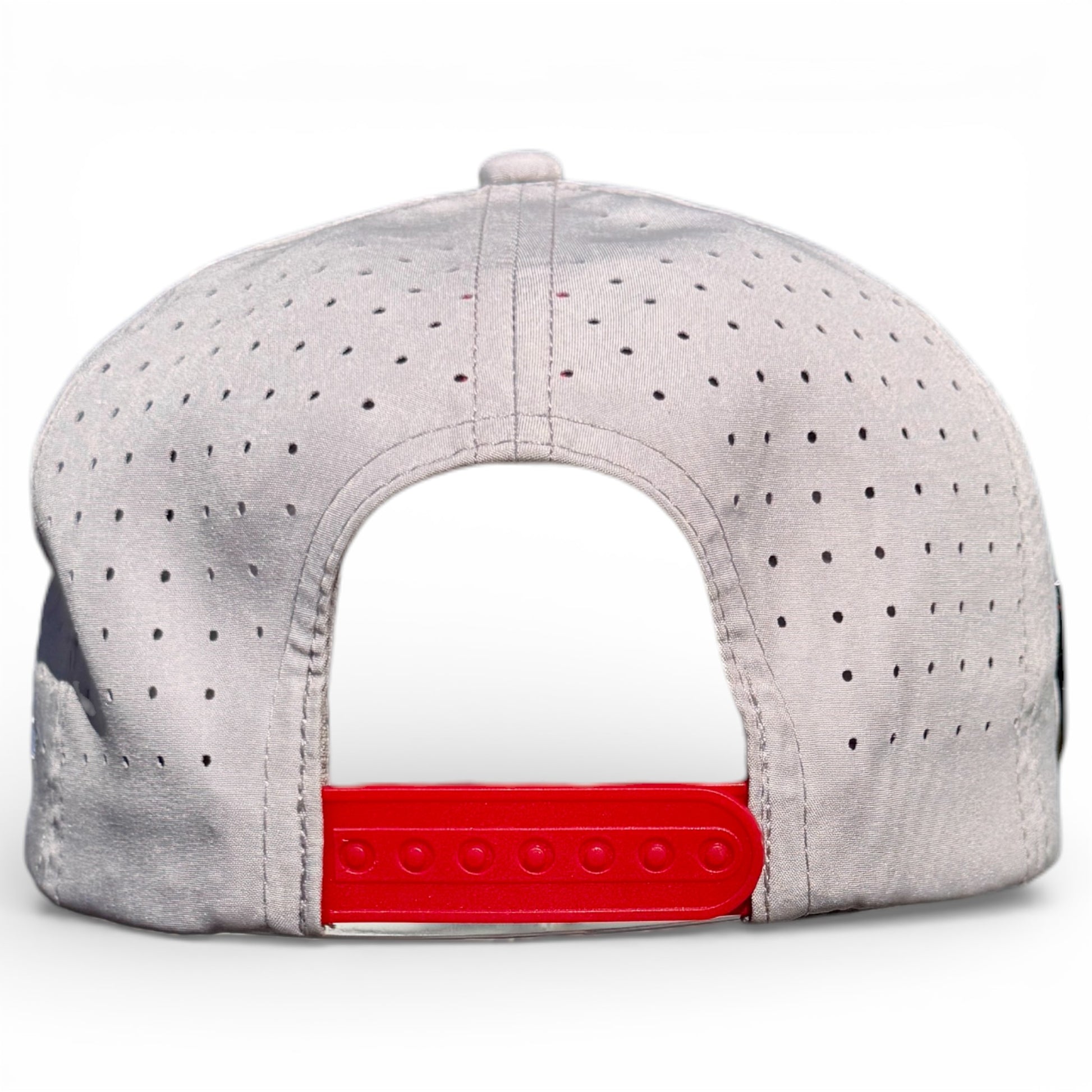 A close-up of the back of the Golf Neon Arrow Sign Hat in light gray, featuring small ventilation holes, a red adjustable snapback strap, and a built-in magnetic ball marker holder with marker, set against a white background.