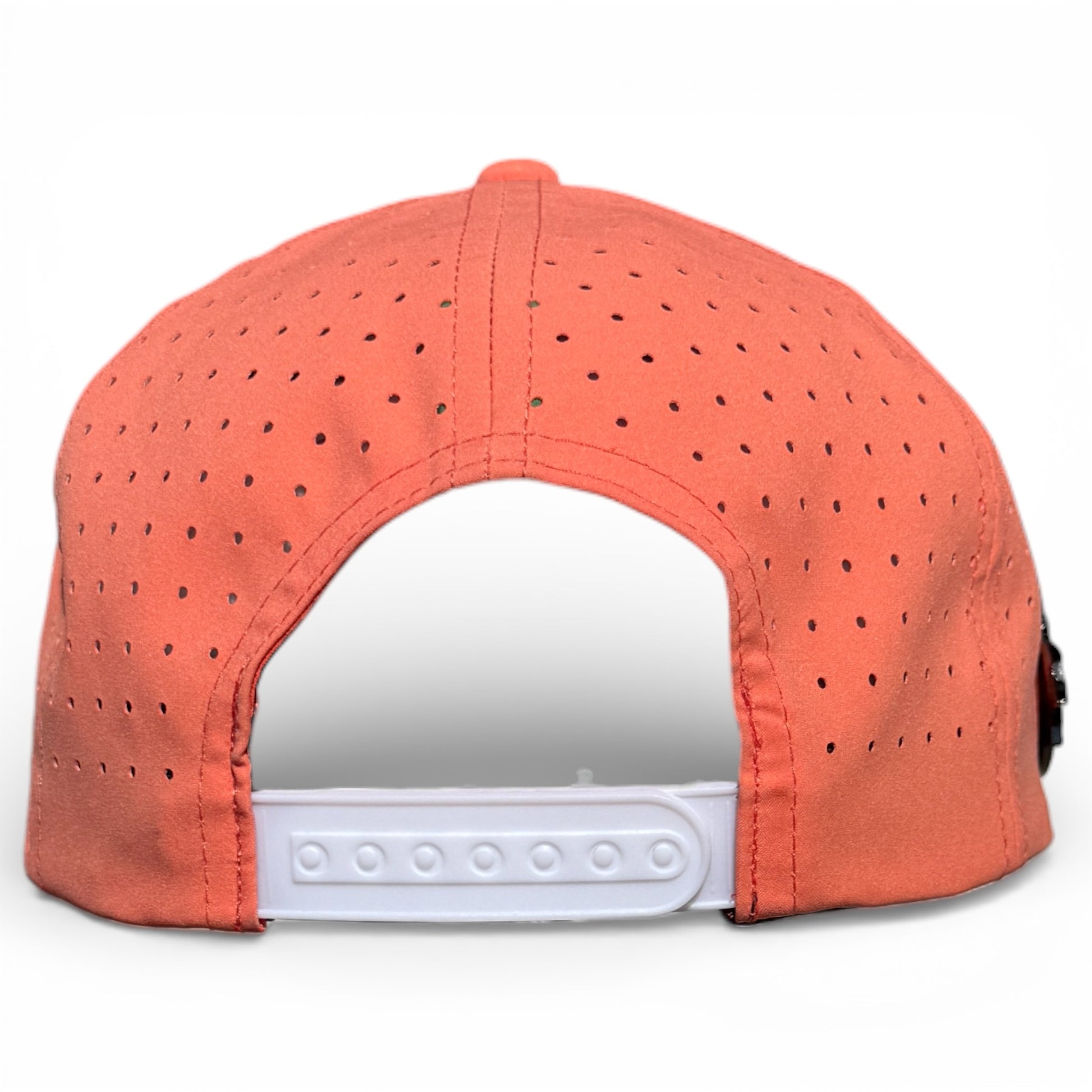 The image shows the back of the Just Peachy Golf Hat, an orange snapback cap with white adjustable closure and ventilation holes. It features a built-in magnetic ball marker holder with marker included, making it ideal for golf.