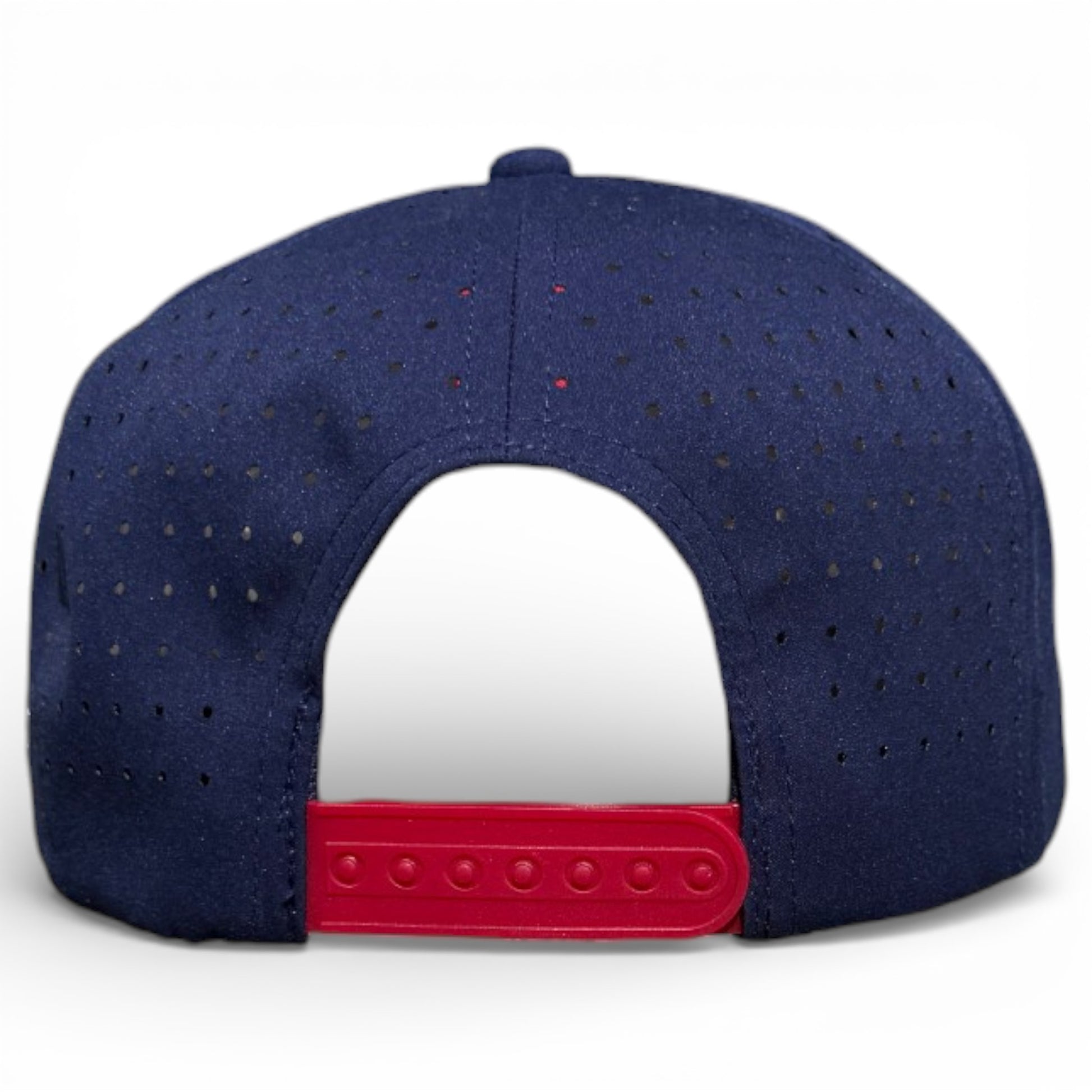The image displays the back of the dark blue Crab Trap Golf Hat, featuring small ventilation holes and a red adjustable snapback. This one-size cap includes a built-in magnetic ball marker holder with marker and is set against a white background.