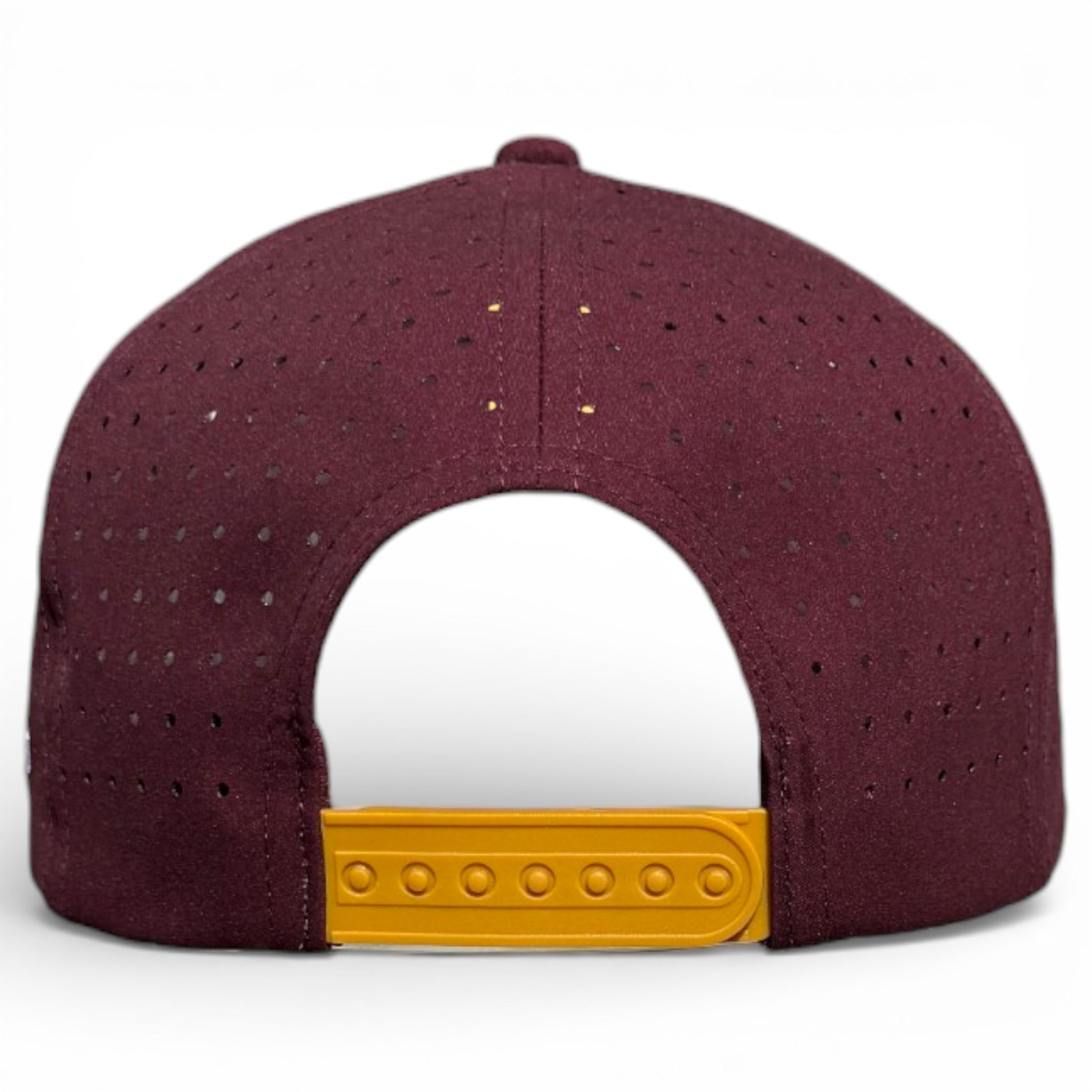 The Cold One Golf Hat is a maroon snapback cap with a yellow adjustable closure, built-in magnetic ball marker holder, and included marker—shown from the back.