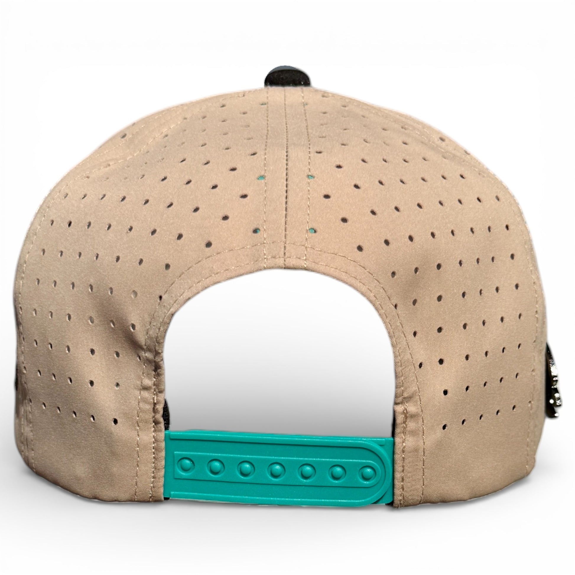 The image shows the back of the Salty Turtle Golf Hat, a beige perforated snapback cap with an adjustable teal plastic closure and built-in magnetic ball marker holder (marker included), displayed against a white background.
