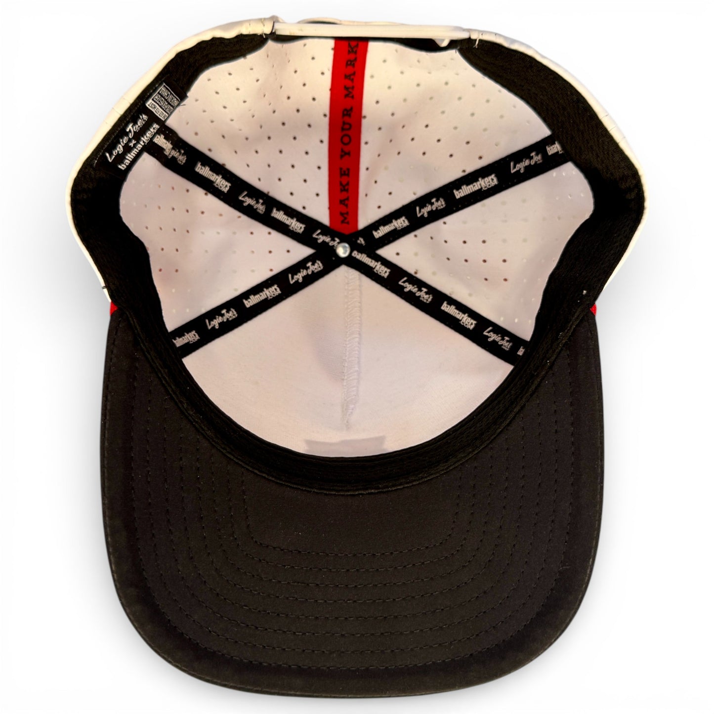 A top-down view of the Pocket Aces Golf Hat shows the black brim and inner band with branded text. The red phrase "MAKE YOUR MARK" is on the lining. This adjustable gray & black snapback cap includes a magnetic ball marker holder and marker.