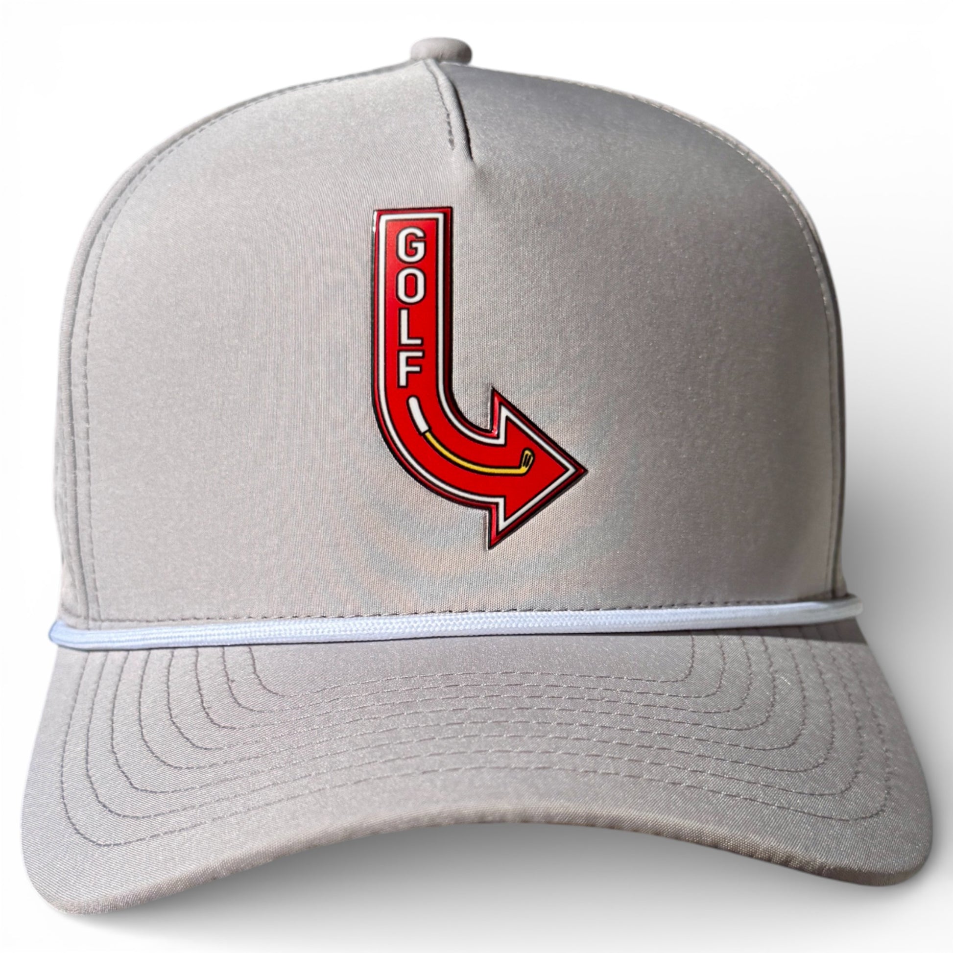 The Golf Neon Arrow Sign Snapback Cap in light gray features a red arrow and bold "GOLF" lettering, plus a white accent line above the brim. Adjustable fit with built-in magnetic ball marker holder and marker included—perfect on or off the course.