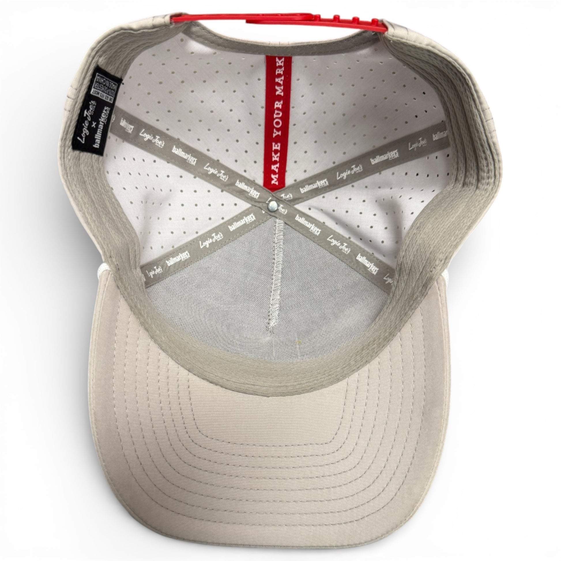 A top-down view of the Golf Neon Arrow Sign Snapback Cap in light gray, showing grey sweatbands, a white perforated lining, and a red strip reading MAKE YOUR MARK along the center. Magnetic ball marker holder with marker included.