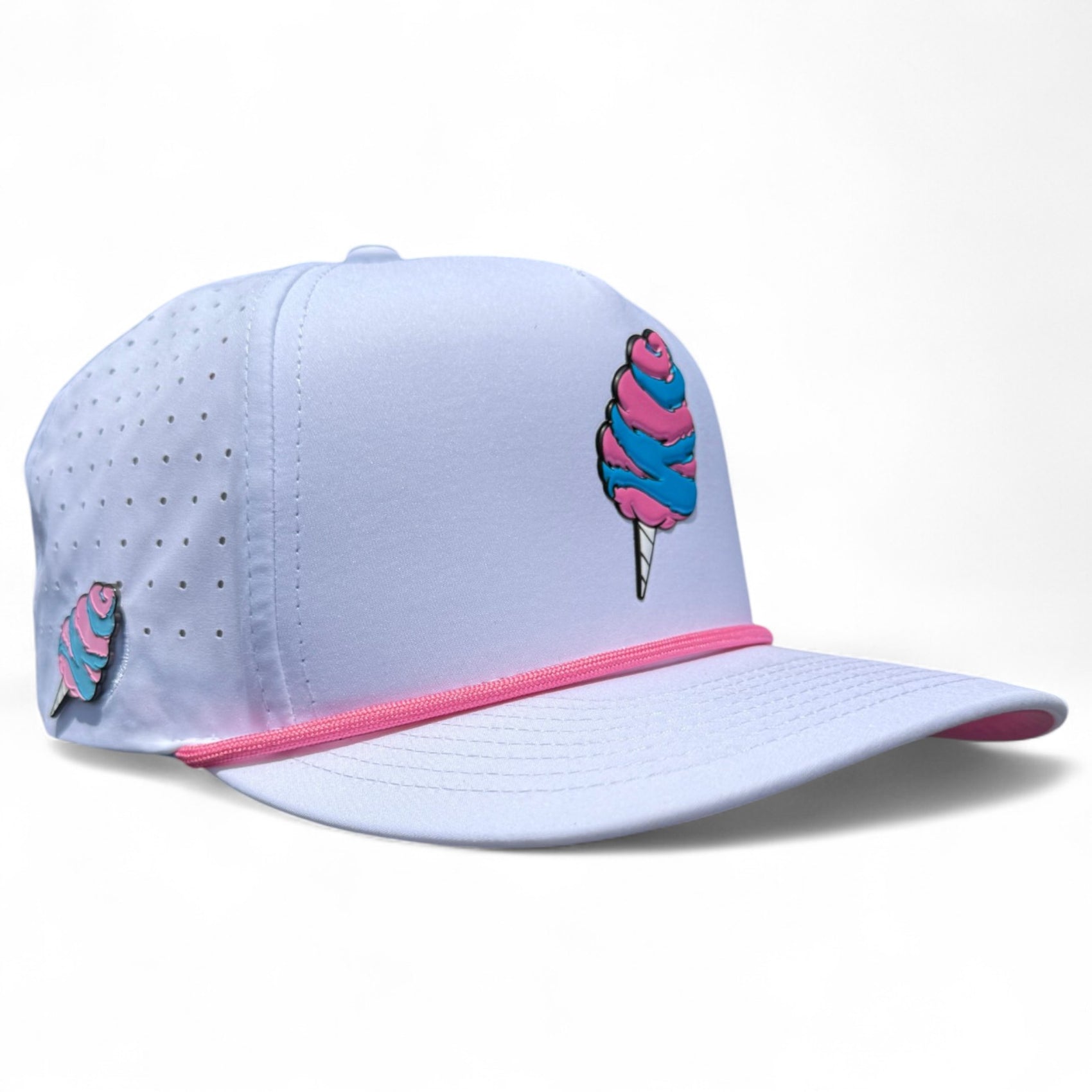 The Sugar Rush Golf Hat is a light purple snapback cap with an adjustable fit, pink trim, cotton candy graphics, side ventilation holes, and a built-in magnetic ball marker holder with marker included.