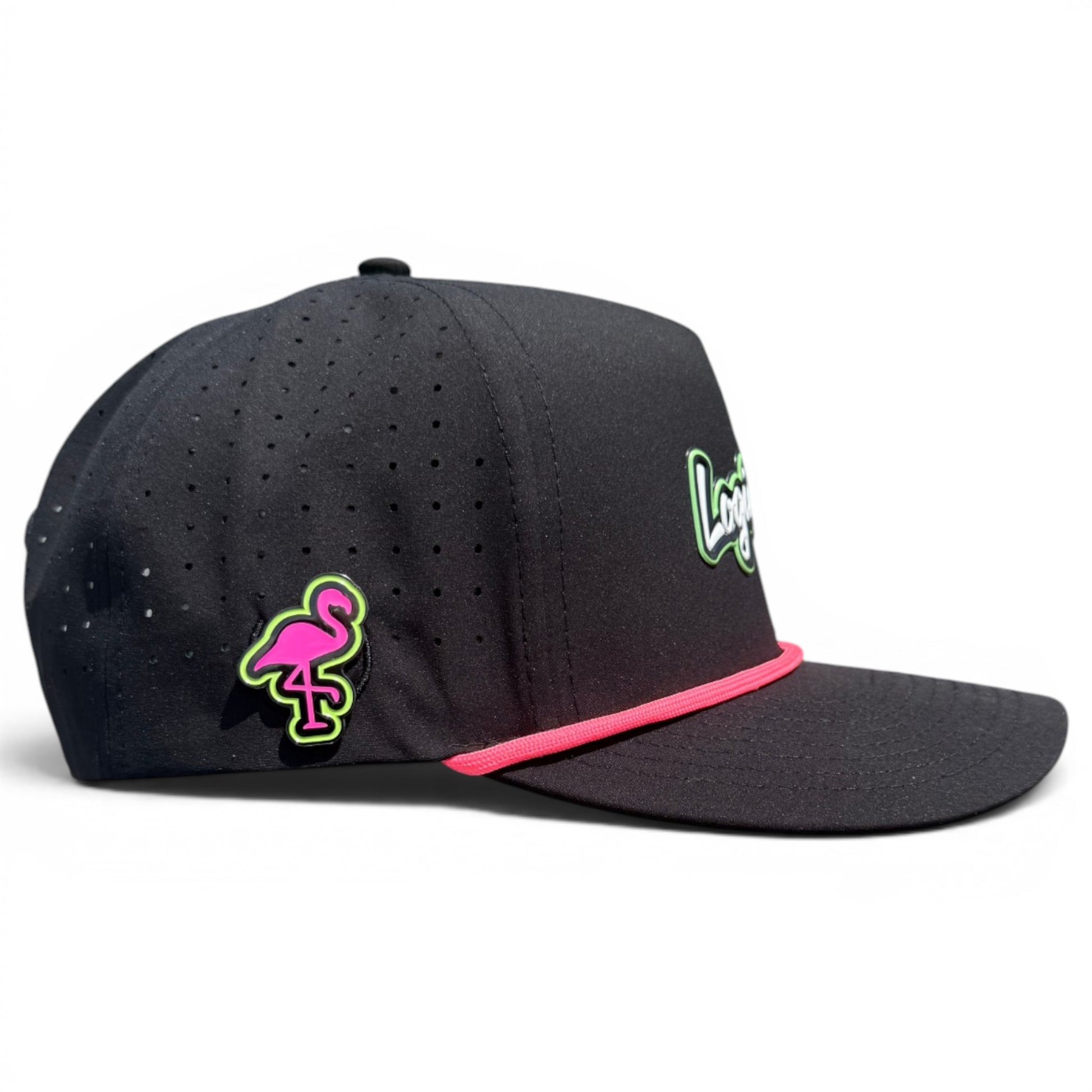 A black Logie Joe’s "Classic" Golf Hat features small ventilation holes, a pink flamingo patch, pink trim, partially visible white and green "Long" script on the front, an adjustable fit, and includes a magnetic ball marker holder with marker.