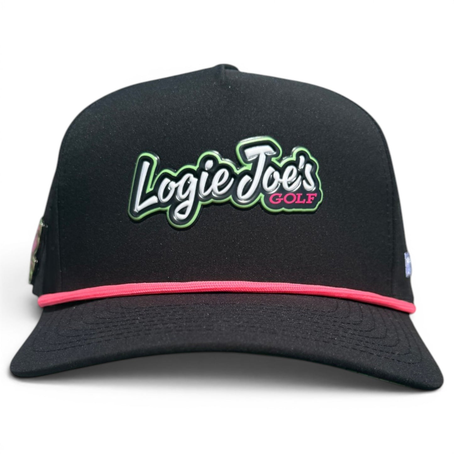 The Logie Joe’s "Classic" Golf Hat is a black snapback cap with an adjustable fit, white and green embroidered logo outlined in pink, a thin pink band above the brim, and features a built-in magnetic ball marker holder plus marker.