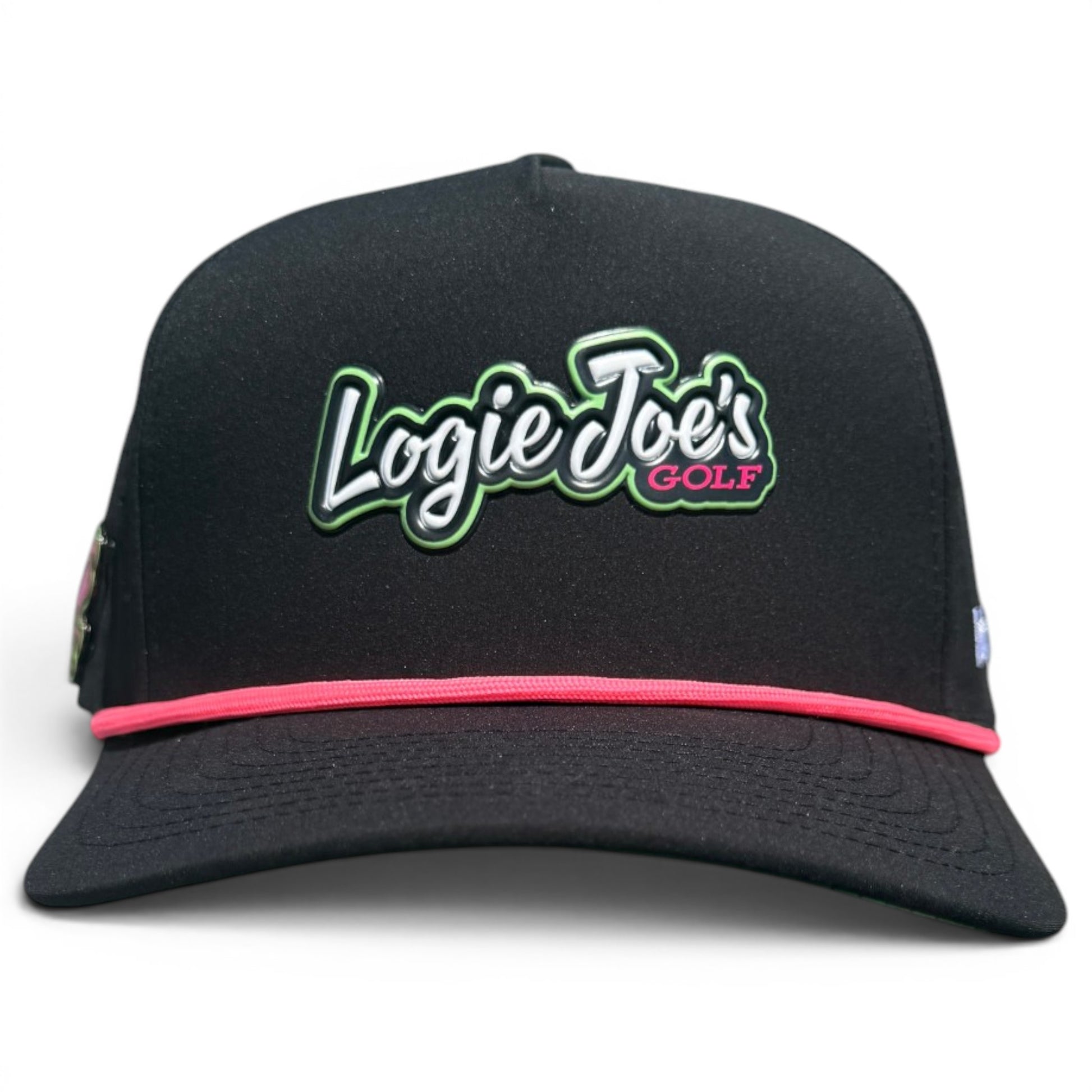 The Logie Joe’s "Classic" Golf Hat is a black snapback cap with an adjustable fit, white and green embroidered logo outlined in pink, a thin pink band above the brim, and features a built-in magnetic ball marker holder plus marker.