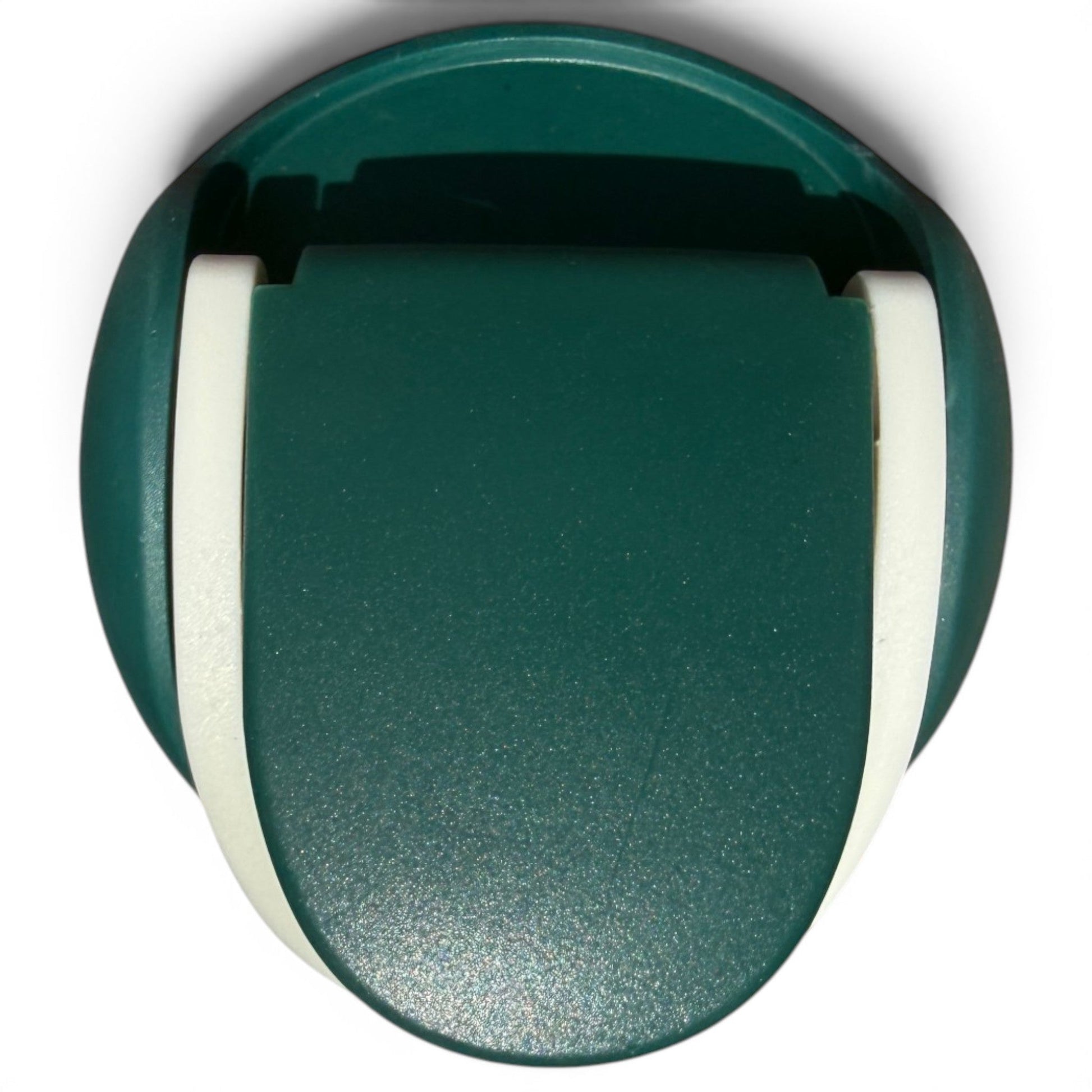 A green and white plastic desktop tape dispenser, seen from above, mimics the sleek look of the Hydration Bottle – The Longhorn 32oz Insulated Stainless Steel with flip straw lid and handle; cutting edge and tape slot are visible.
