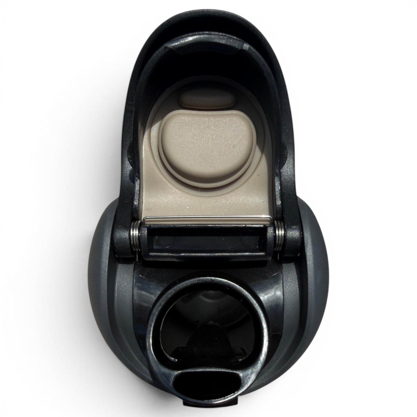 A close-up photo of a coffee maker portafilter and drip area from above, featuring the filter compartment, hinge, dispensing opening, and a 32oz Shark Bite Hydration Bottle with insulated stainless steel and flip straw lid conveniently nearby.