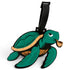 The Salty Turtle Clip-On Tag is a green and brown cartoon turtle bag tag with a black strap, featuring a playful expression and pipe—an ideal multi-use travel or golf accessory for those who love whimsical designs.