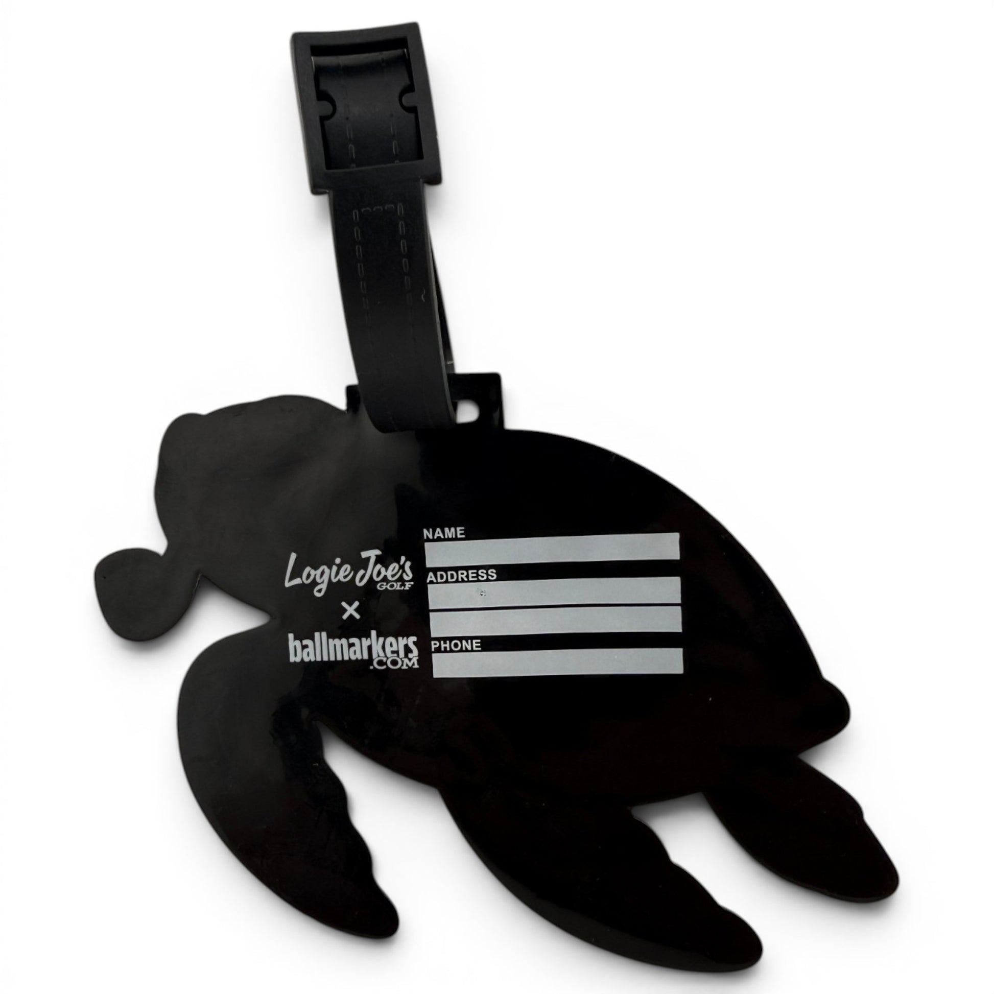 The Salty Turtle Clip-On Tag is a black turtle-shaped bag tag with a writable area for your info, sturdy strap, and white Logie Joes text. It’s ideal as a multi-use bag tag, travel tag, or unique golf accessory.