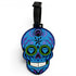 The Blue Sugar Skull Clip-On Tag features vibrant blue and purple patterns, diamond-shaped eyes, green accents, and a black strap—ideal as a writable luggage label or bold golf accessory.