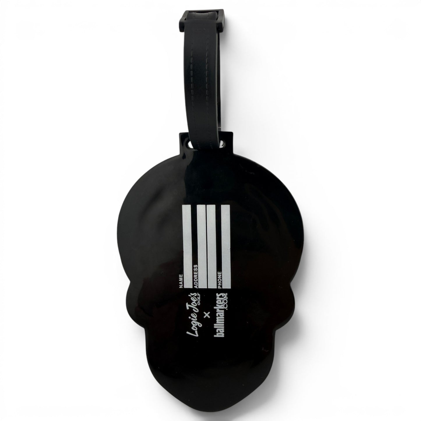 The Blue Sugar Skull Clip-On Tag is a multi-use, writable bag tag and golf accessory featuring white vertical lines and “Larger than life” plus “Human Made” text—perfect for travel or adding a unique touch to any bag.