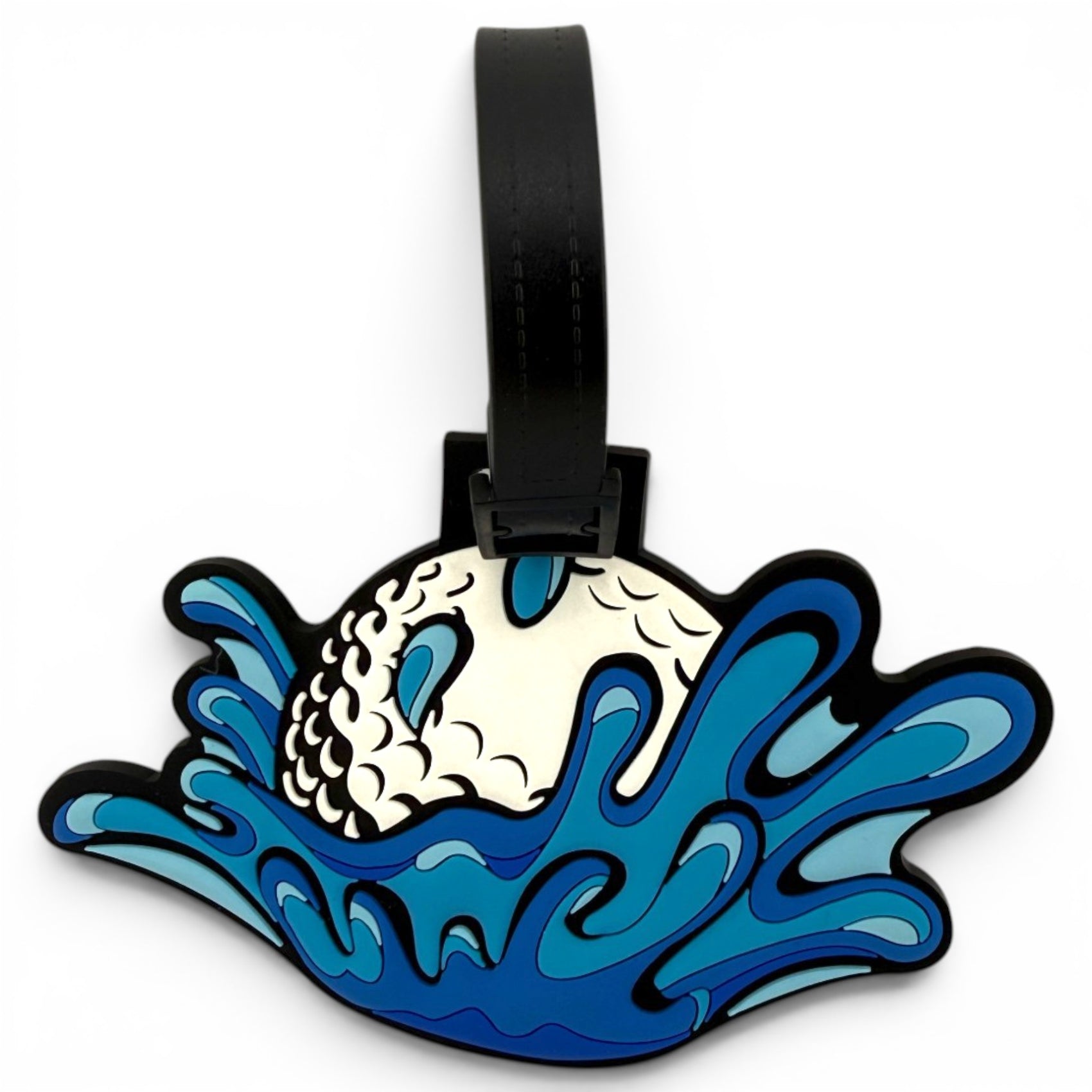 The Water Ball Clip-On Tag is a multi-use bag or travel tag and golf accessory, featuring a stylized fish tail splashing in blue water and finished with a black strap at the top.