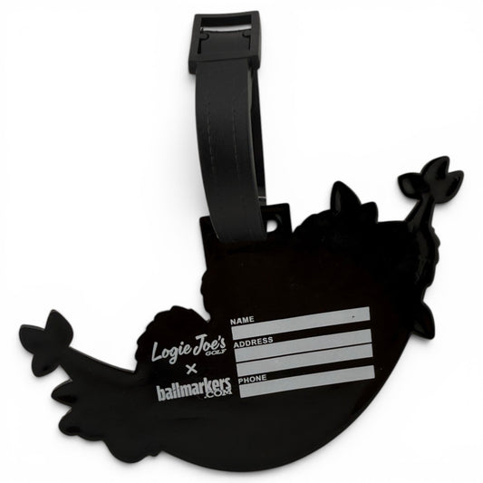 The Banana Hammock Clip-On Tag is a black narwhal-shaped bag tag with a strap, perfect for travel or golf bags. Includes fields for your name, address, and phone number, plus Logie Joes Golf and ballmarkers.com logos.