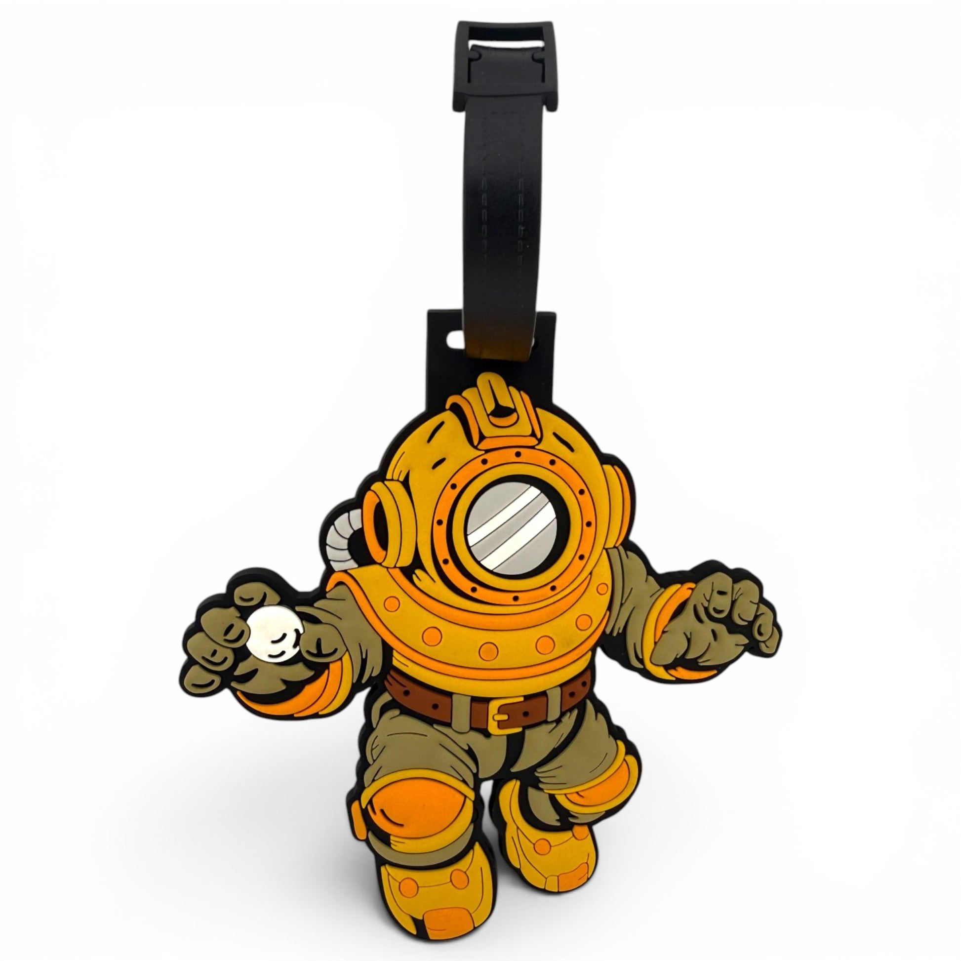 The Deep Dive Clip-On Tag is a cartoon-style bag tag shaped like a vintage diver in orange and olive, with a round helmet and black strap—perfect as a unique travel tag or golf accessory.