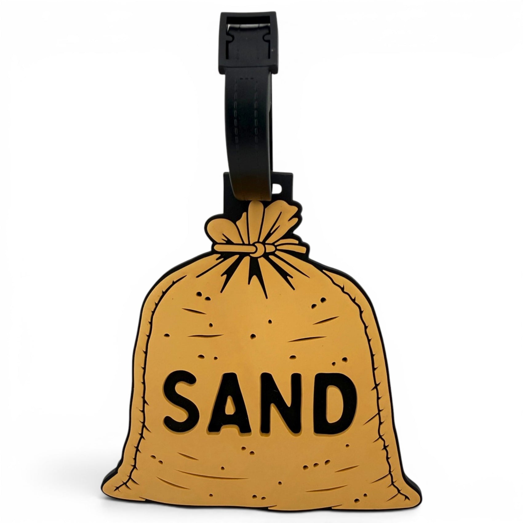 The Sand Bag Clip-On Tag is a brown sack-shaped travel tag with "SAND" in bold black letters and a black strap—perfect as a fun luggage tag or unique golf accessory.