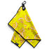The Main Squeeze Golf Towel is a 24” x 16” yellow microfiber towel with lemon slice and pink splatter designs, black edging, a logo tag, and a magnetic clip plus carabiner for convenience on the course.
