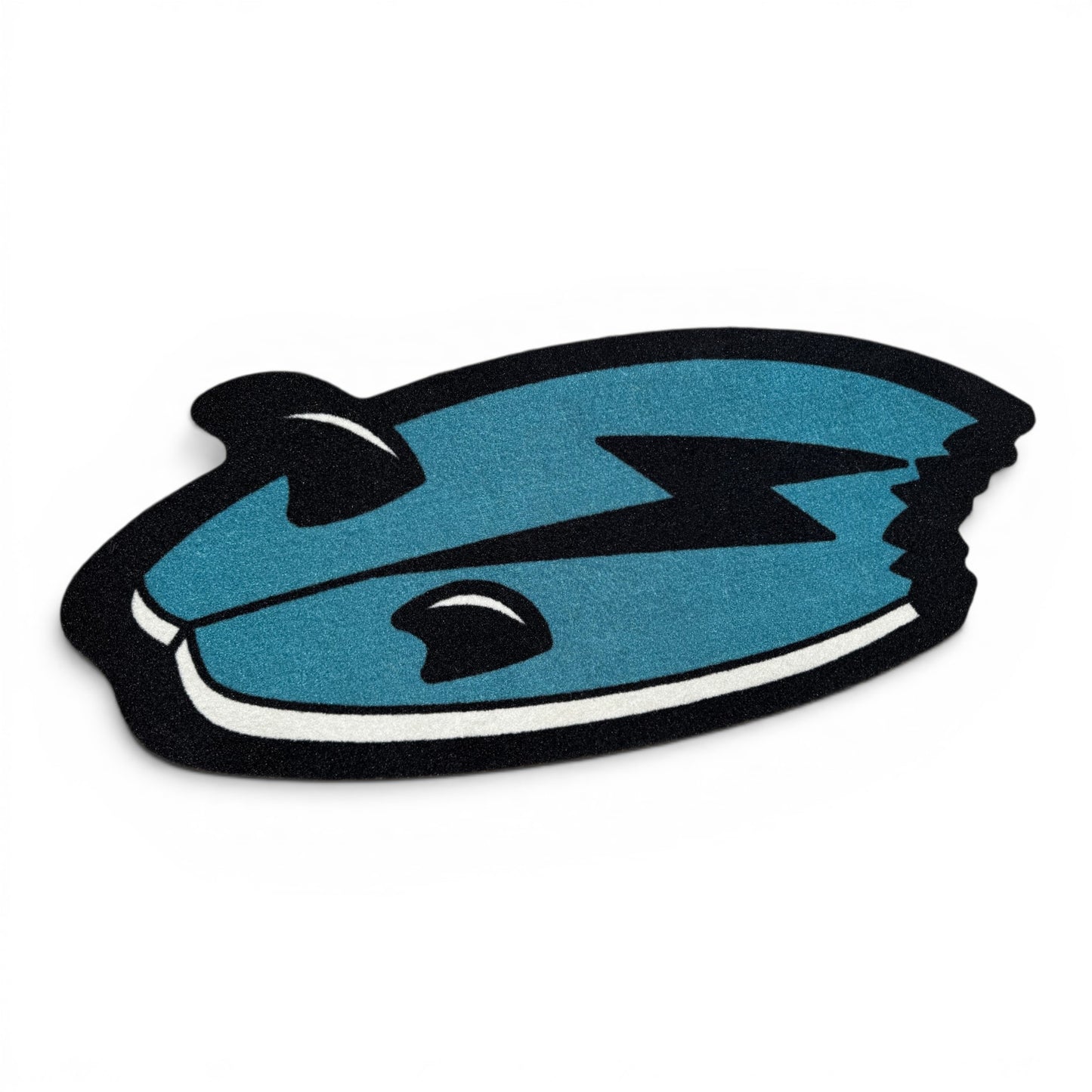 The Shark Bite Golf Shop Mat features a cartoon blue fish with black fins, a lightning bolt, and a bite mark—ideal as a playful cart accessory or shop mat from Logie Joe’s, shown on a crisp white background.