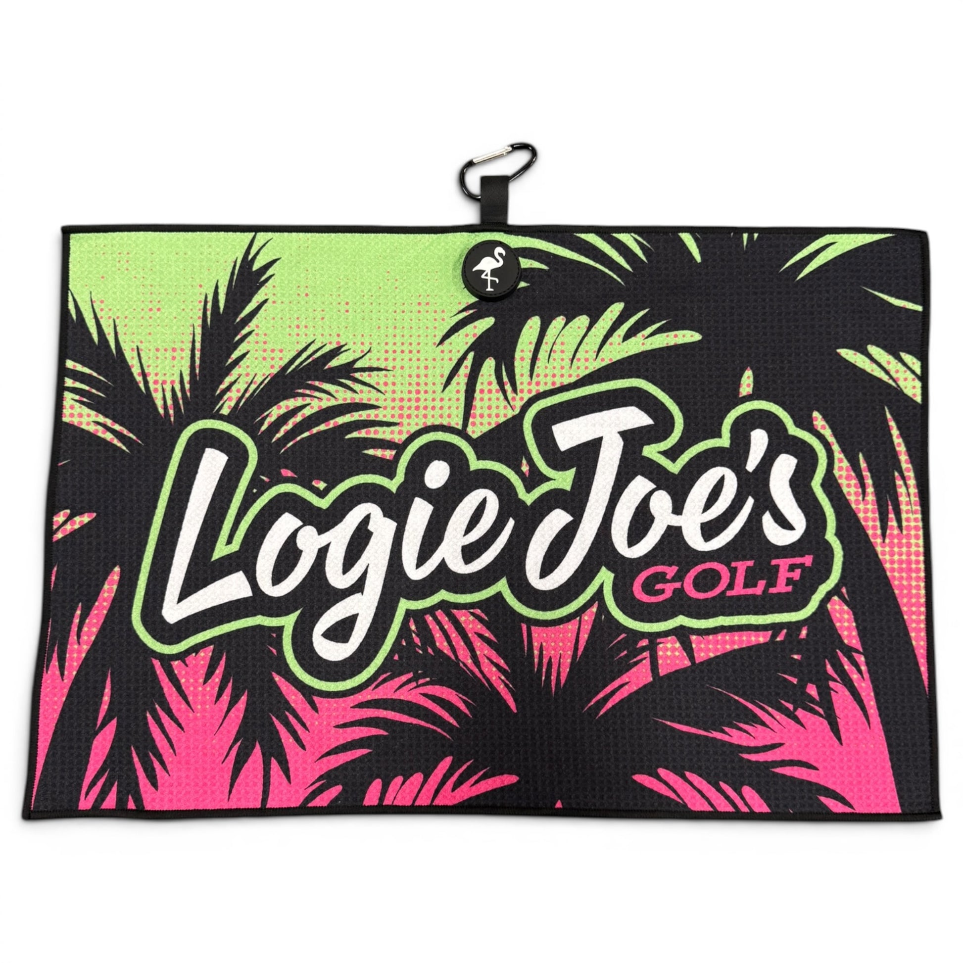 The Neon Palms Golf Towel (24” x 16”), a premium microfiber golf towel, features "Logie Joes GOLF" in bold white and pink on a black, green, and pink palm tree background. Includes a magnetic clip, carabiner, and flamingo button.