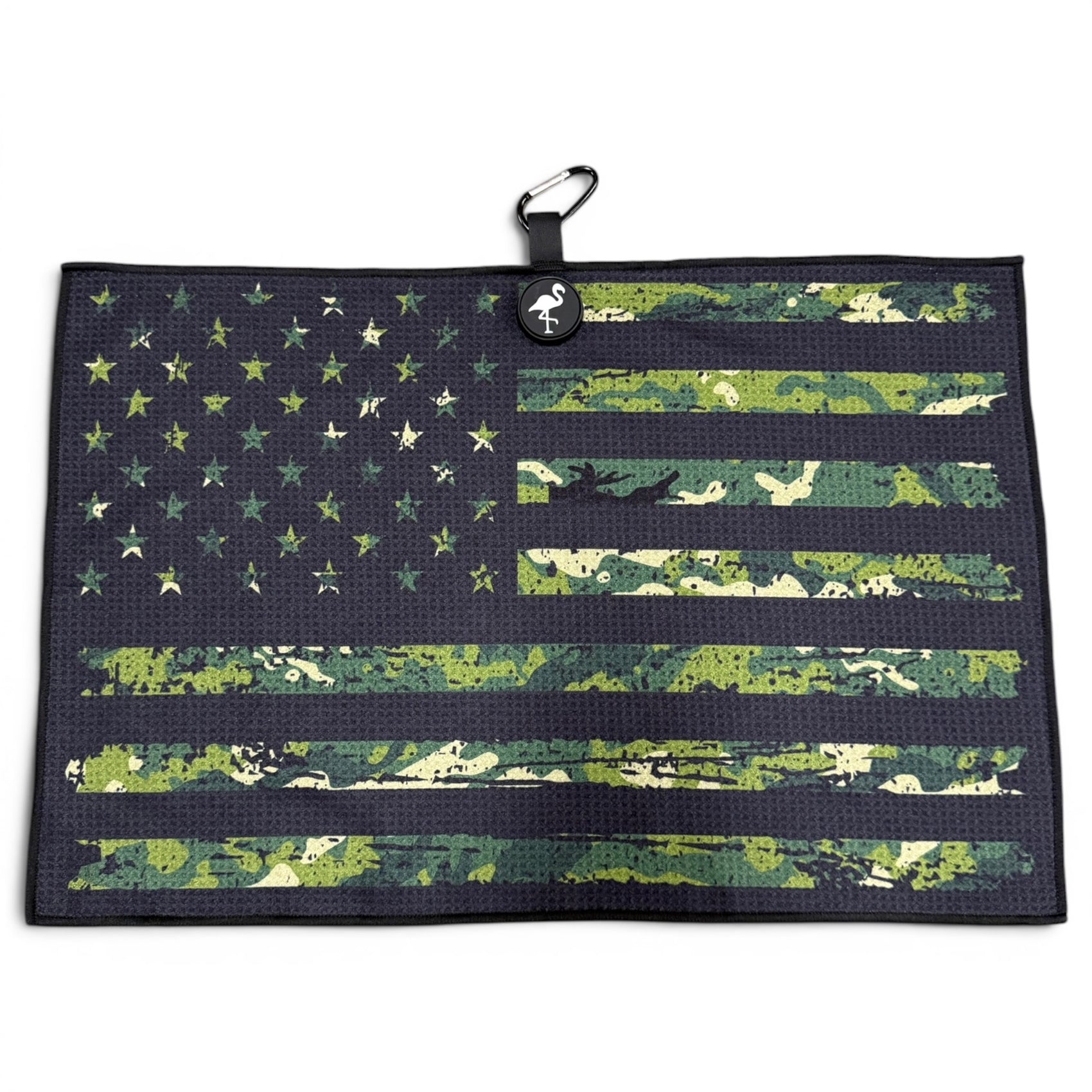 The Tactical Golf Towel is a 24” x 16” microfiber towel with a green camo and black American flag design, featuring a magnetic clip and carabiner for easy hanging—a premium golf accessory.