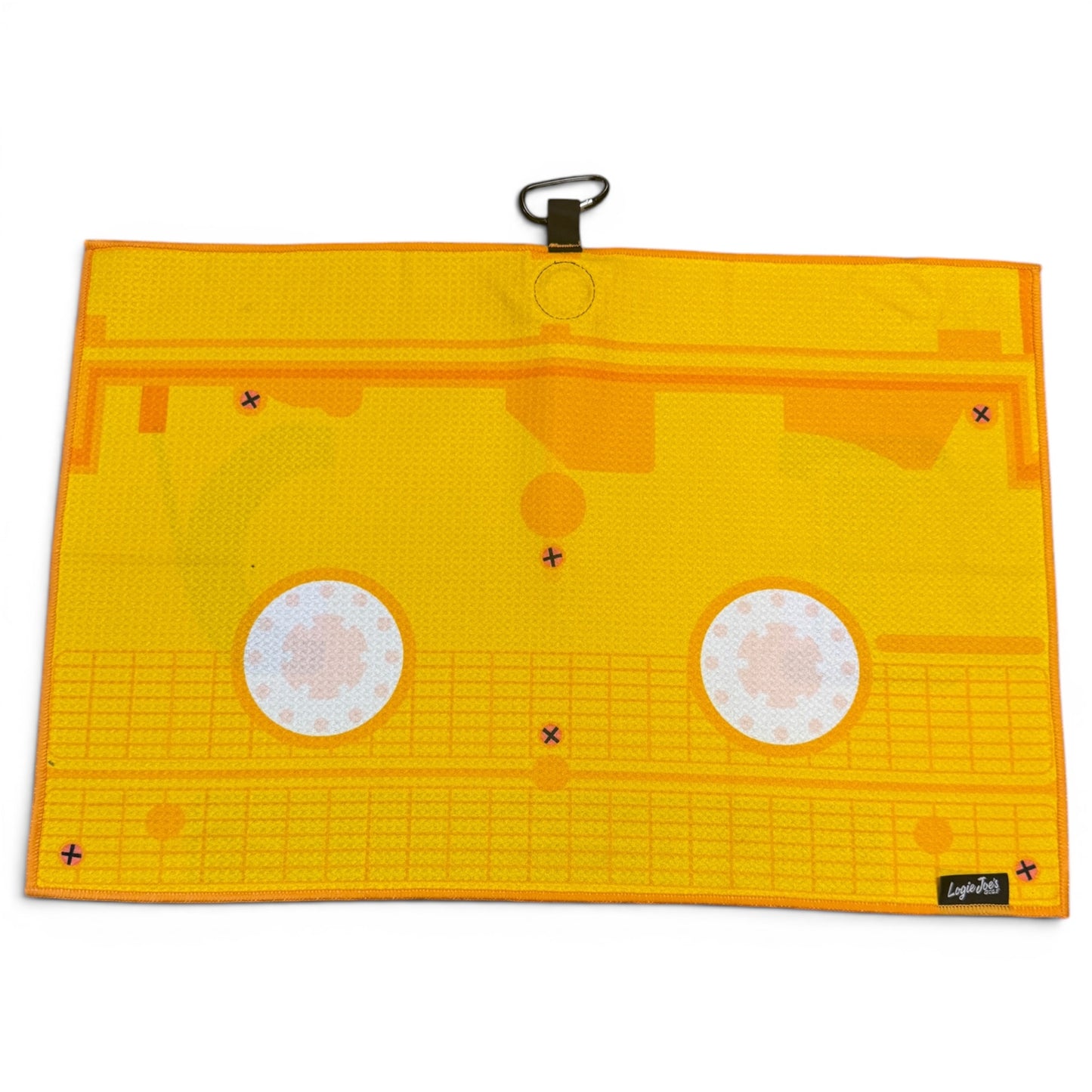 The Block Party Golf Towel is a 24” x 16” yellow microfiber towel with orange cassette-like patterns, two white circles, a magnetic clip at the top center, and a black Laylo Pets label in the bottom right corner.