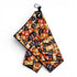The Hot Sauce Golf Towel is a 24"x16" premium double-sided microfiber towel with heavy-duty magnet, carabiner clip, and a vibrant hot sauce packet print—perfect for style and cleaning on the course.