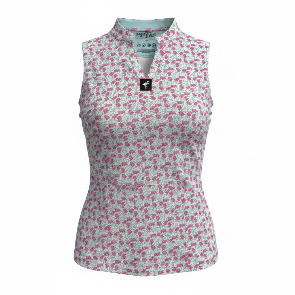 The Women's Frosted Animal Cookies Sleeveless Golf Polo is a moisture-wicking performance top with a white base and pink/grey floral pattern, split V-neck, and fitted silhouette for stylish comfort on the course.